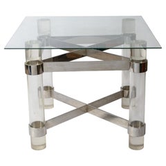 Mesa con estructura en cruz de acrílico y acero de Paul Jones