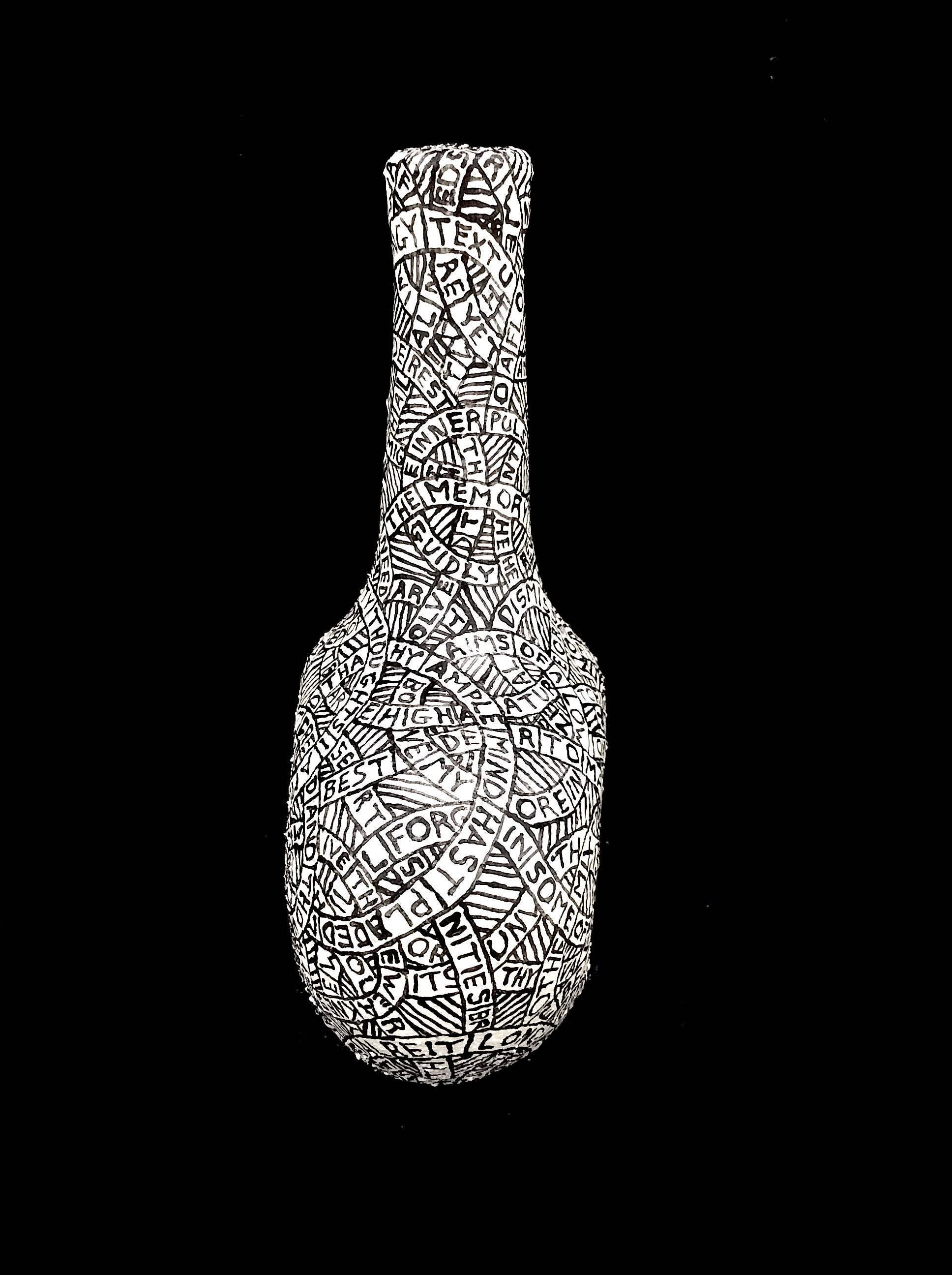 Plaster, sand, & paint on found object
9 x 7 x 3.5 inches

This black and white sculpture was created by Hudson Valley-based artist Paul Katz, whose process involves coating found objects in plaster, sand, & paint. The inscription which coats the
