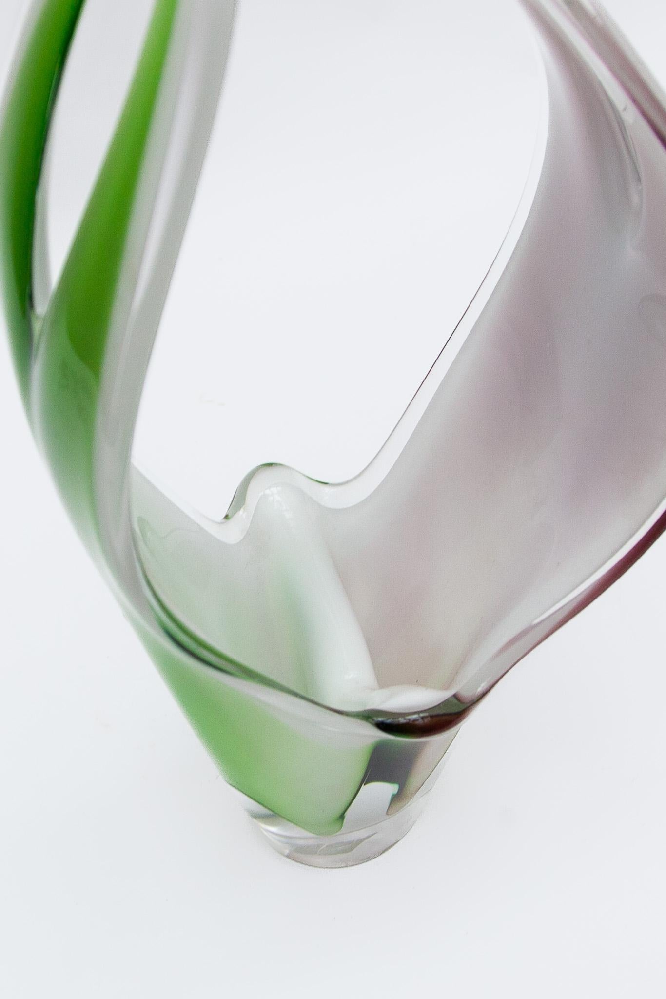 A beautiful model Coquille art glass vase sculpture from 1957, designed by Paul Kedelv at Flygsfors glassworks in Sweden. It is 37 cm high and in excellent condition.Featured mout-blown glass in three colors white opal, purple and green.