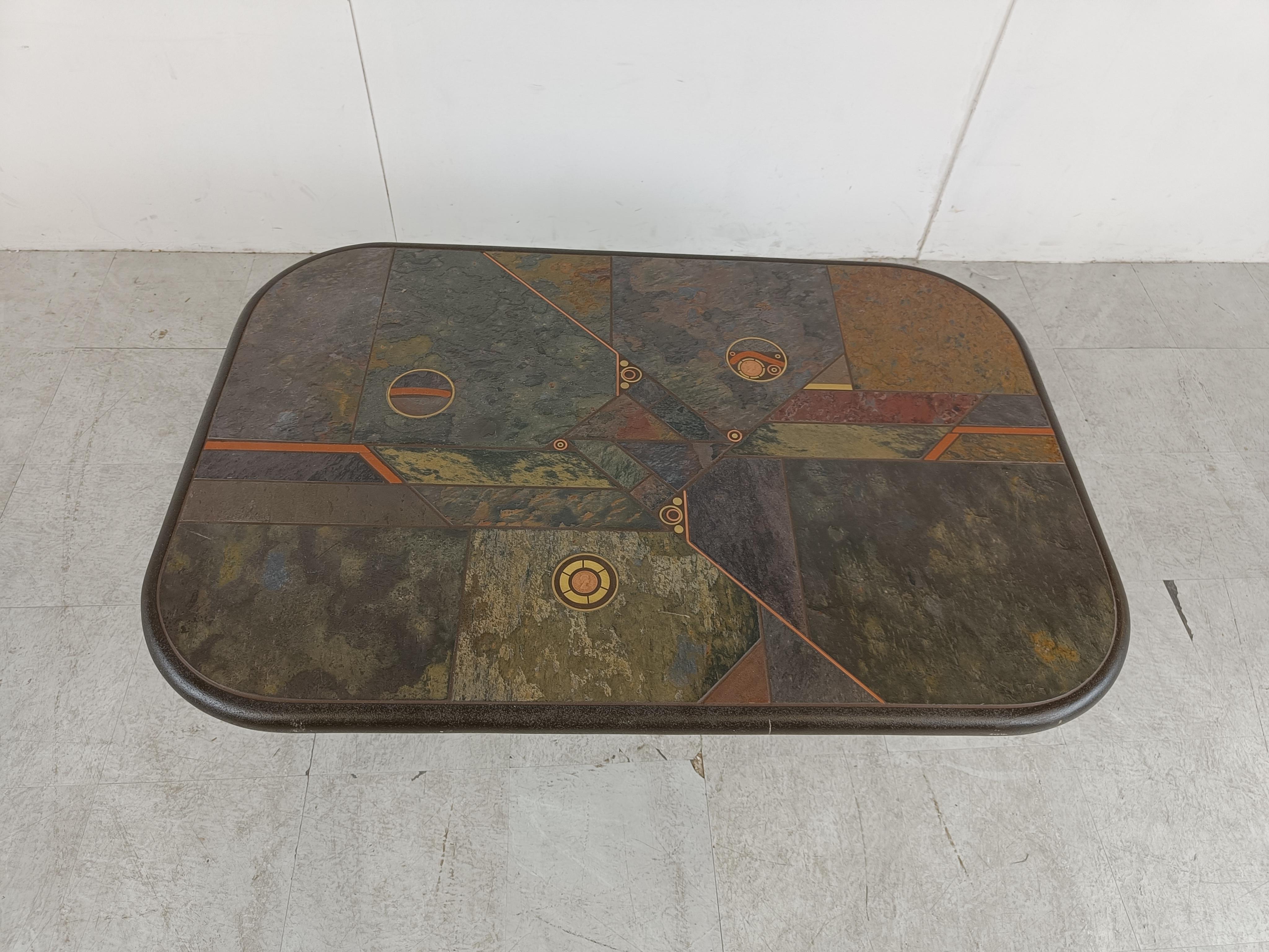 Brutalist slate and natural stone top coffee table with inlaid copper and brass.


The table is signed but we cant see by who.

Good condition.

Very much in the style of Paul Kingma.

1980s - Germany

Height: 46cm/18.11