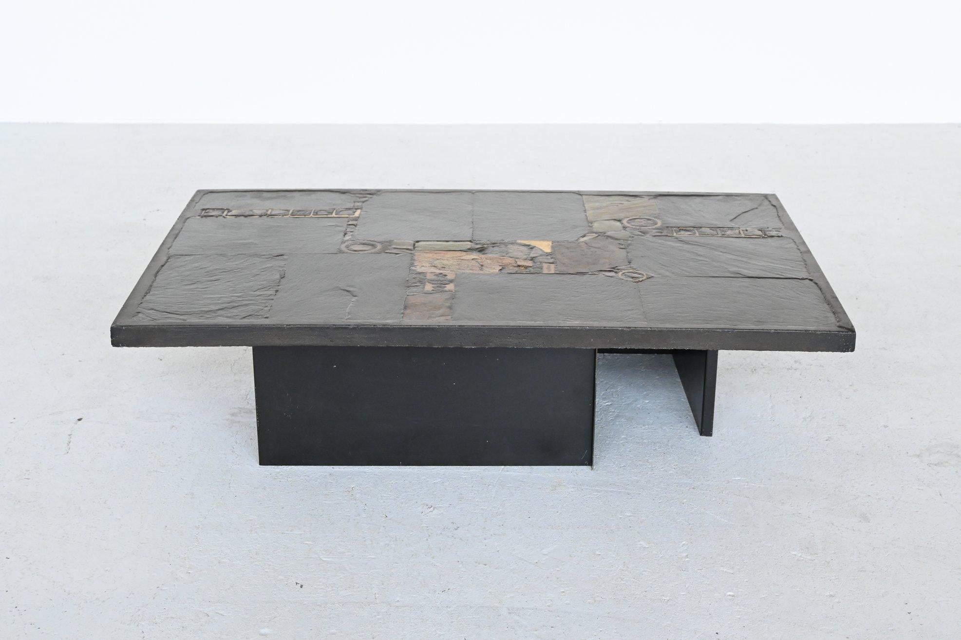 Beautiful rectangular shaped coffee table designed and made by Paul Kingma, The Netherlands 1970. The heavy concrete top rests on 2 metal L-shaped bases that are black lacquered. Beautiful composition of slate, stones, copper and brass makes this