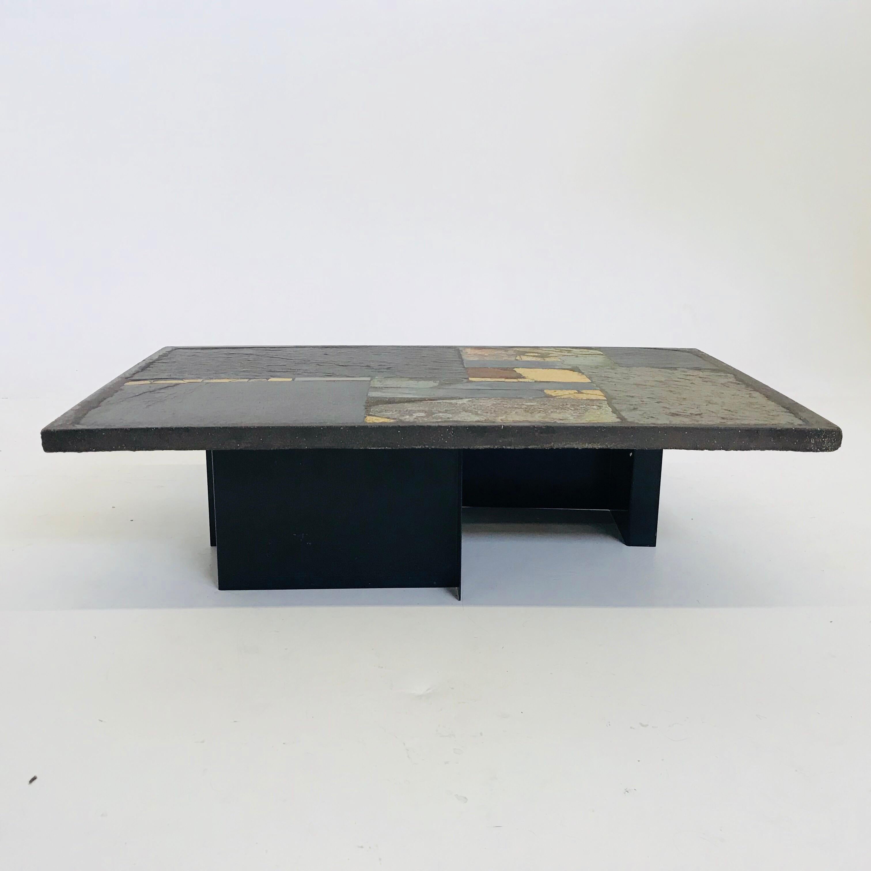 Heavy black Brutalist coffee table, handmade and designed by the late Dutch artist Paul Kingma in 1990. Every table is a one of a kind piece. Paul Kingma used a variety of materials that he collected throughout his life and travels. A real gem. The