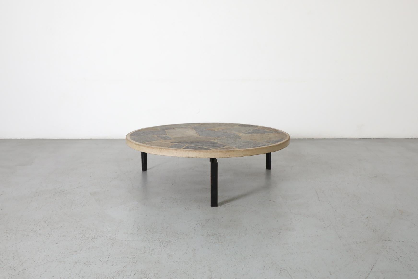 Mid-Century Modern Paul Kingma Style Round Textured Stone Top Coffee Table with Black Enameled Base For Sale