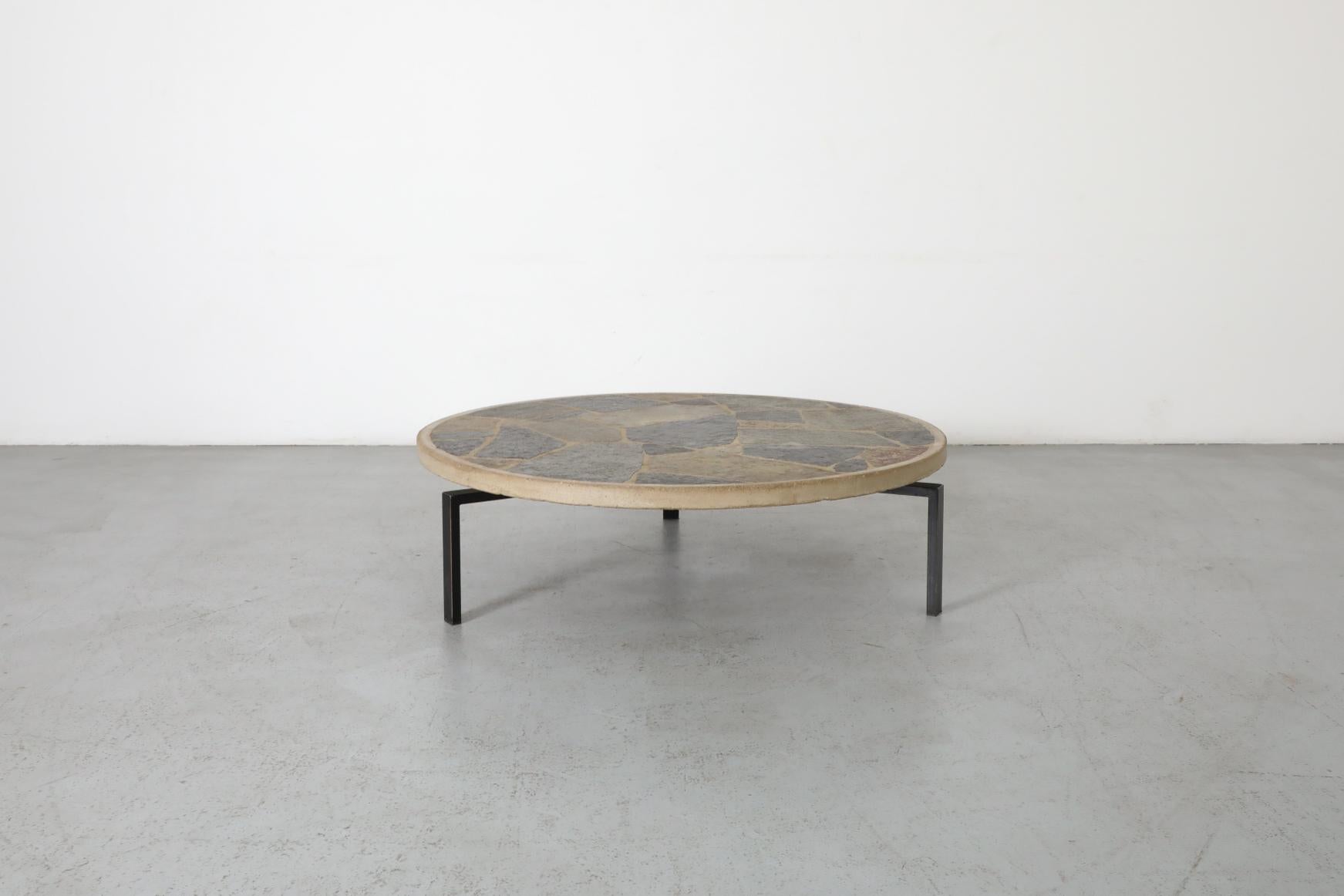 Paul Kingma Style Round Textured Stone Top Coffee Table with Black Enameled Base In Good Condition For Sale In Los Angeles, CA