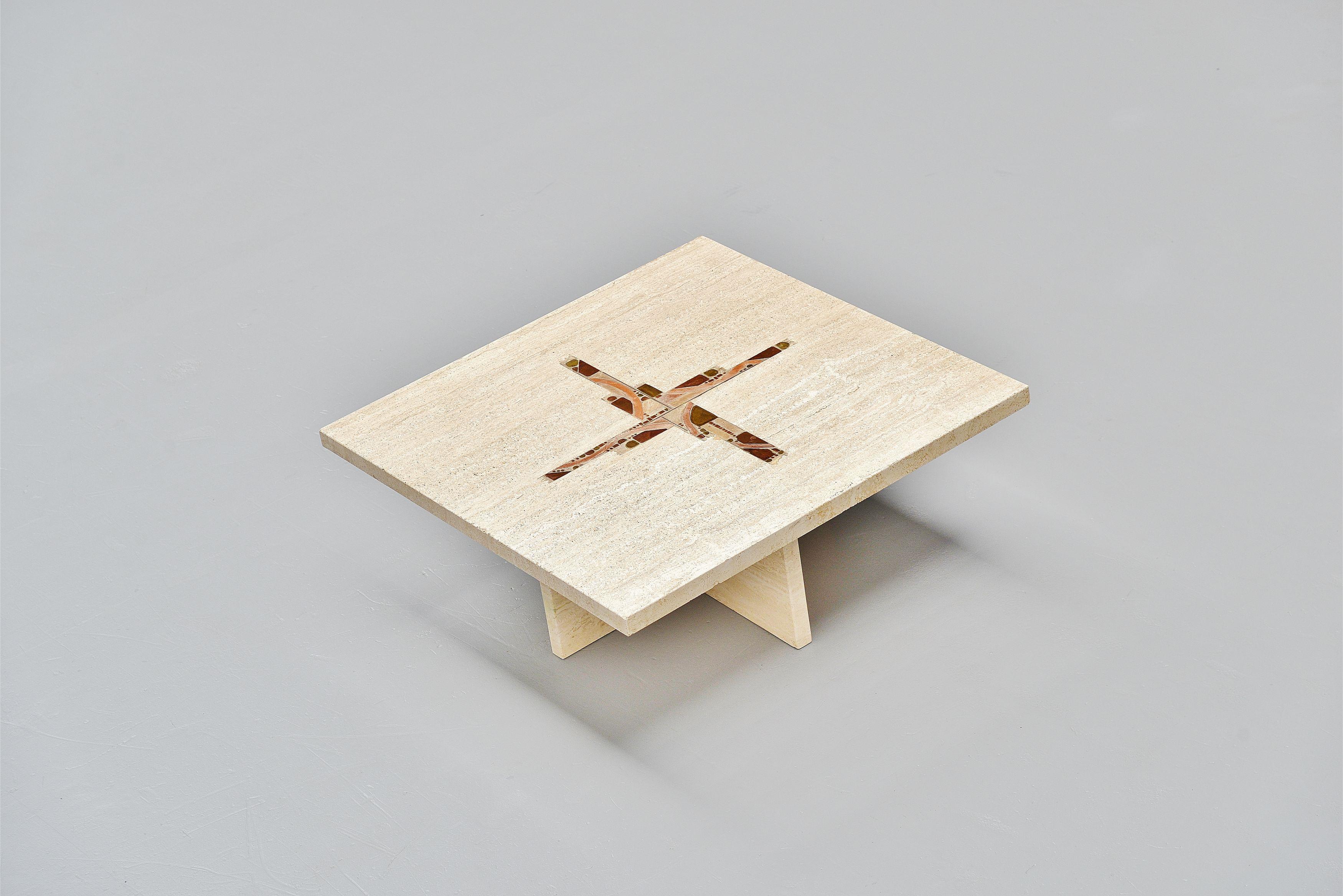 Nice solid travertin coffee table with cross inlay designed and made by Paul Kingma, Holland, 1978. The table is made of solid travertin and has an inlayed cross pattern with brass tiles and mineral stones. The table has a very nice brutal shape,