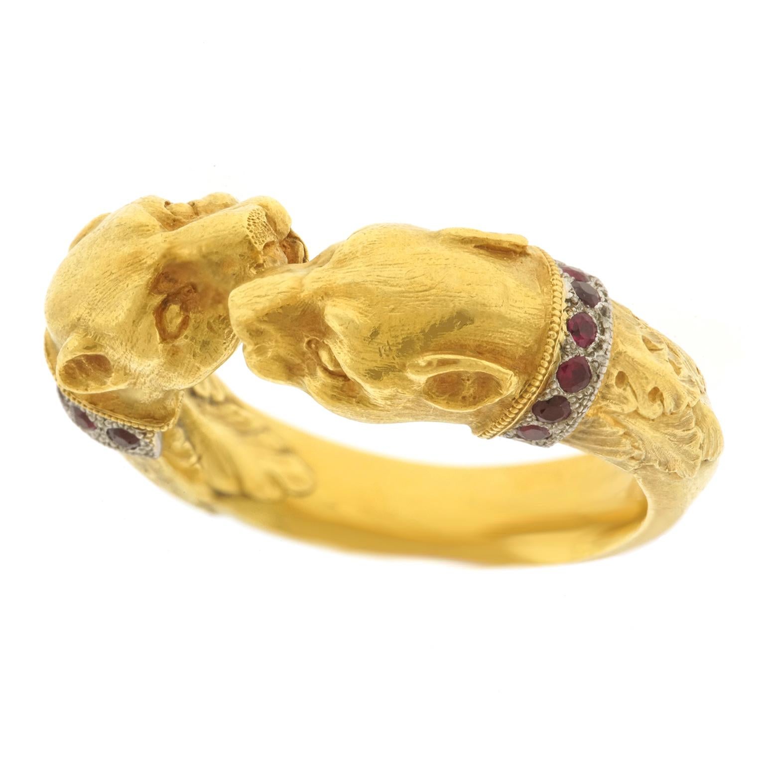 Circa 2003, 18k, Platinum, by Paul Lantuch, American. This eighteen-karat gold and platinum  Renaissance Revival ring is decorated with finely detailed lion heads, underscored by ruby-set platinum collars and a profuse acanthus leaf motif. Known for