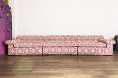 Paul Laszlo Attributed Curved Sectional Sofa Reupholstered in Pink Ikat Fabric