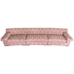 Paul Laszlo Attributed Curved Sectional Sofa Reupholstered in Pink Ikat Fabric