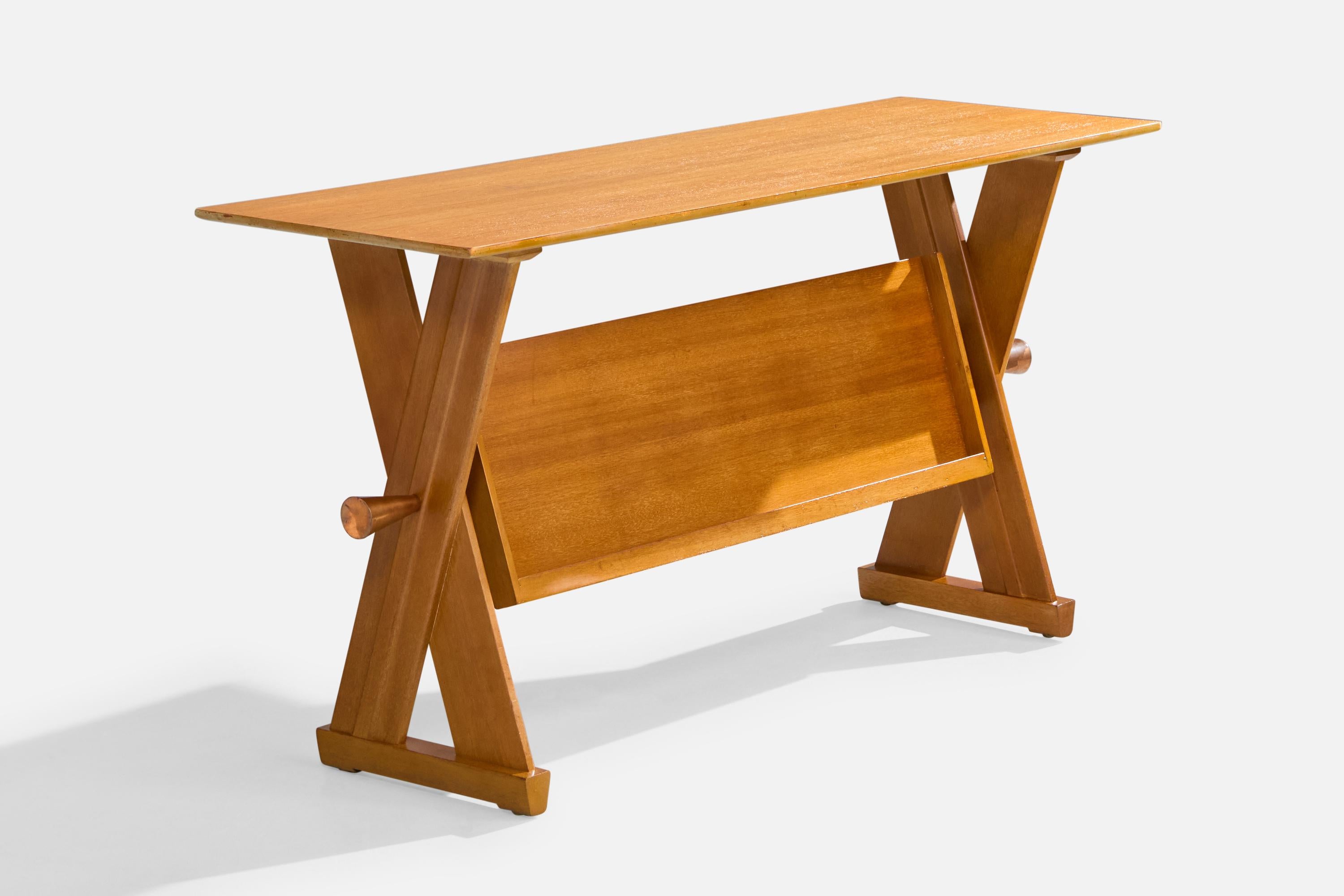 An oak and copper console table with magazine holder designed by Paul Laszlo and produced by Brown Saltman, California, USA, c. 1950s.

The copper sidebars present with light oxidation.

Overall Dimensions: 28.25” H x 54.1” W x 18.1” D

Dimensions