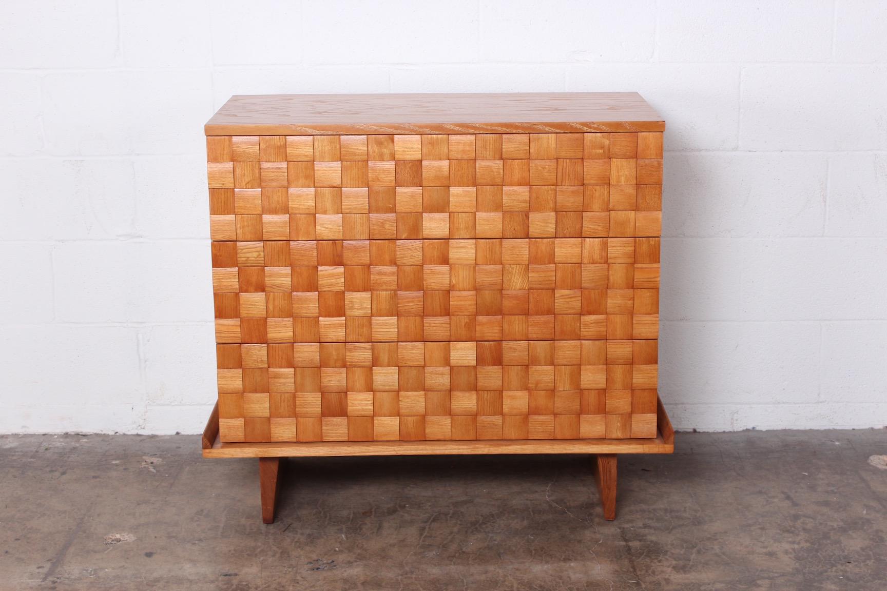 An oak three-drawer chest designed by Paul Laszlo for Brown Saltman.
