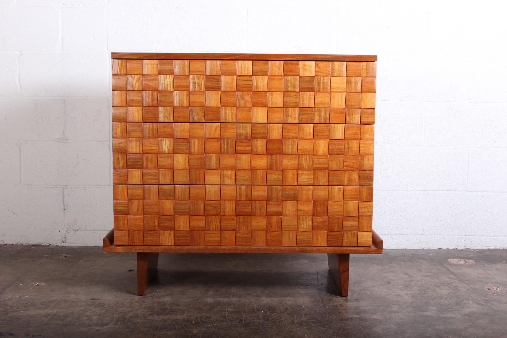 An oak three-drawer chest designed by Paul Laszlo for Brown Saltman.