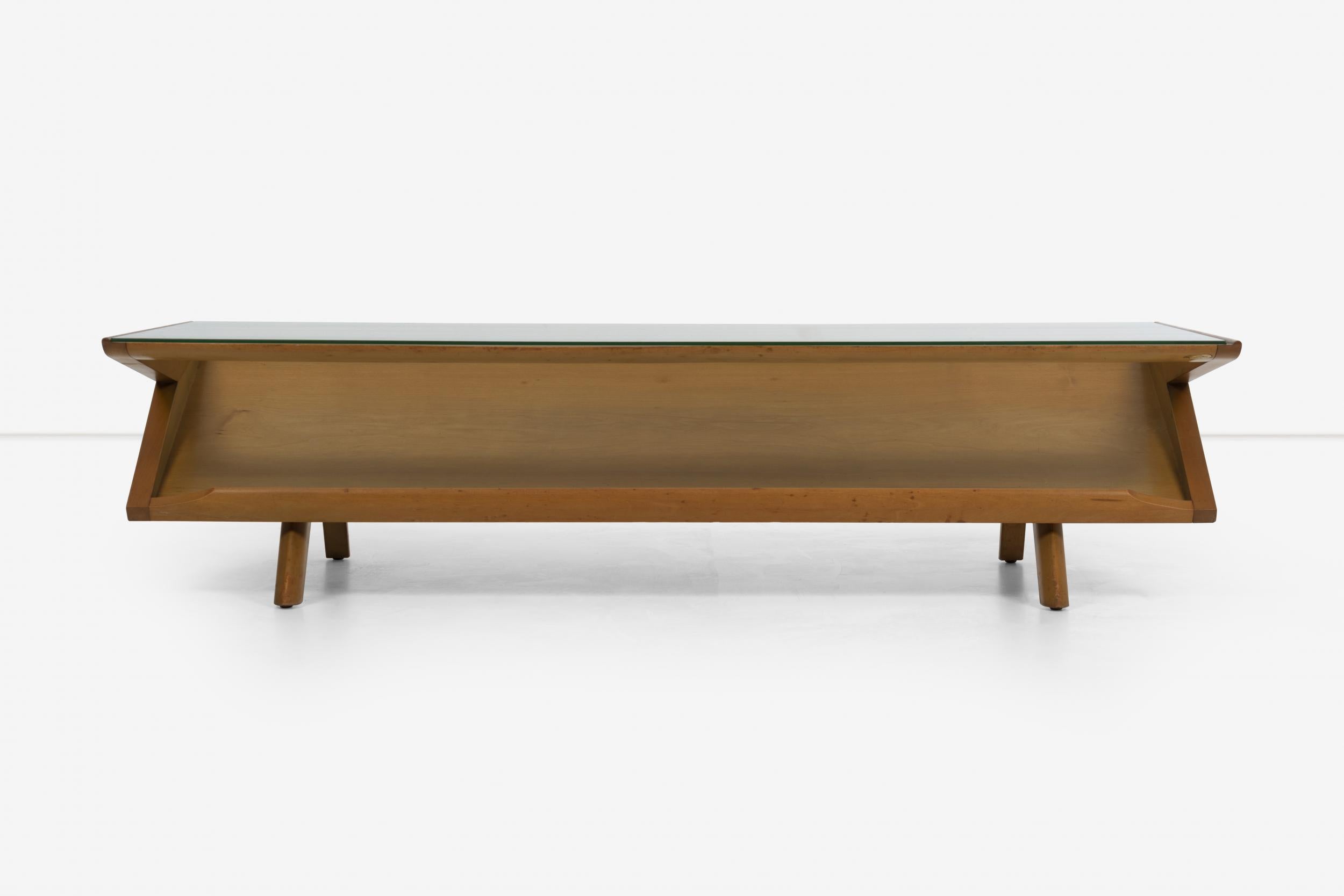 Paul Laszlo for Brown and Saltman display coffee table
Maple-Wood frame and angled wood structure with ledge and glass top for book or magazine display.