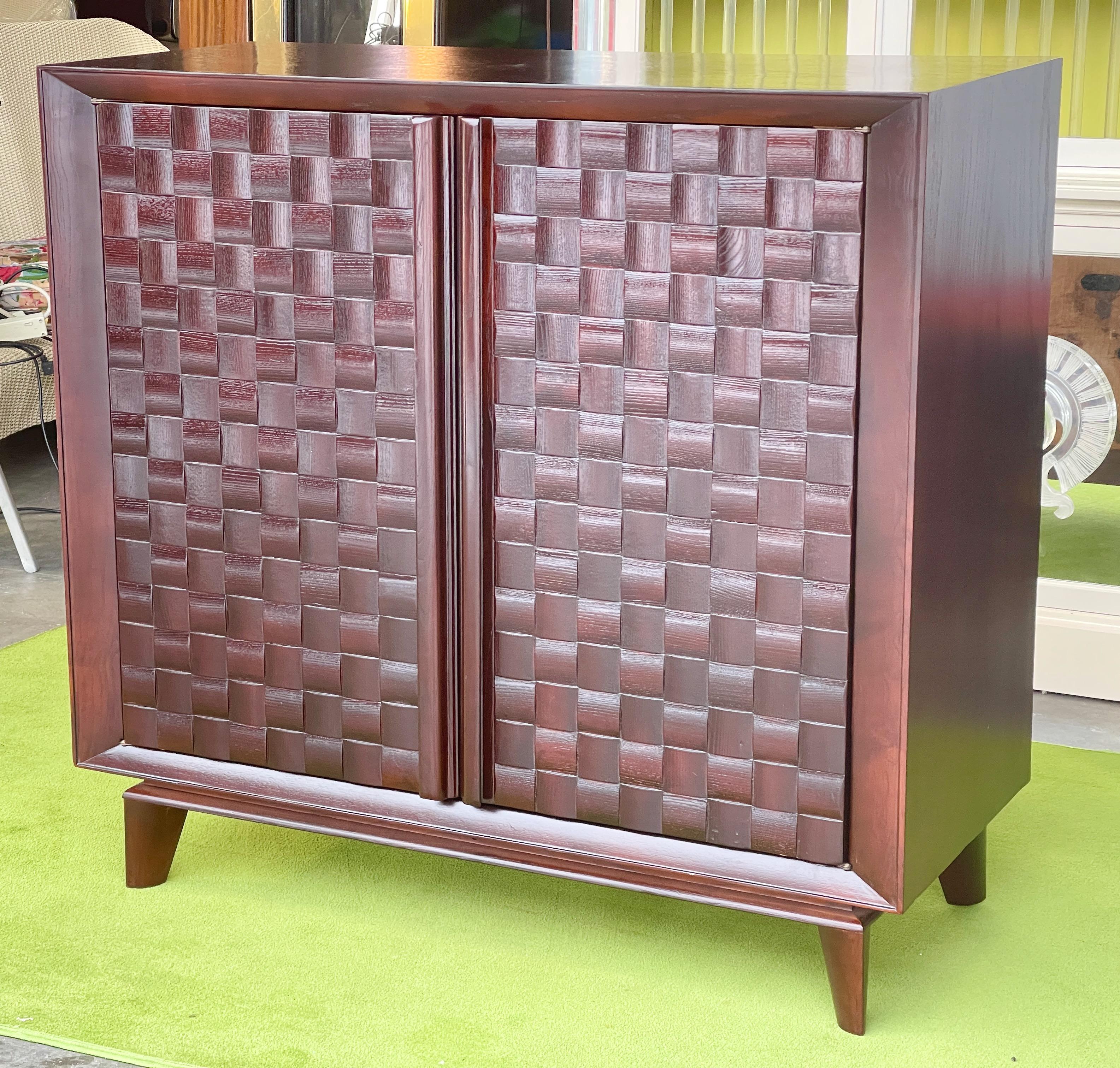 Paul Laszlo for Brown Saltman (signed) basket weave double door cabinet in American white oak newly refinished in dark walnut. 
Originally this cabinet was blonde and contained GE Musaphonic hi-fi equipment with a pull-put turntable drawer and