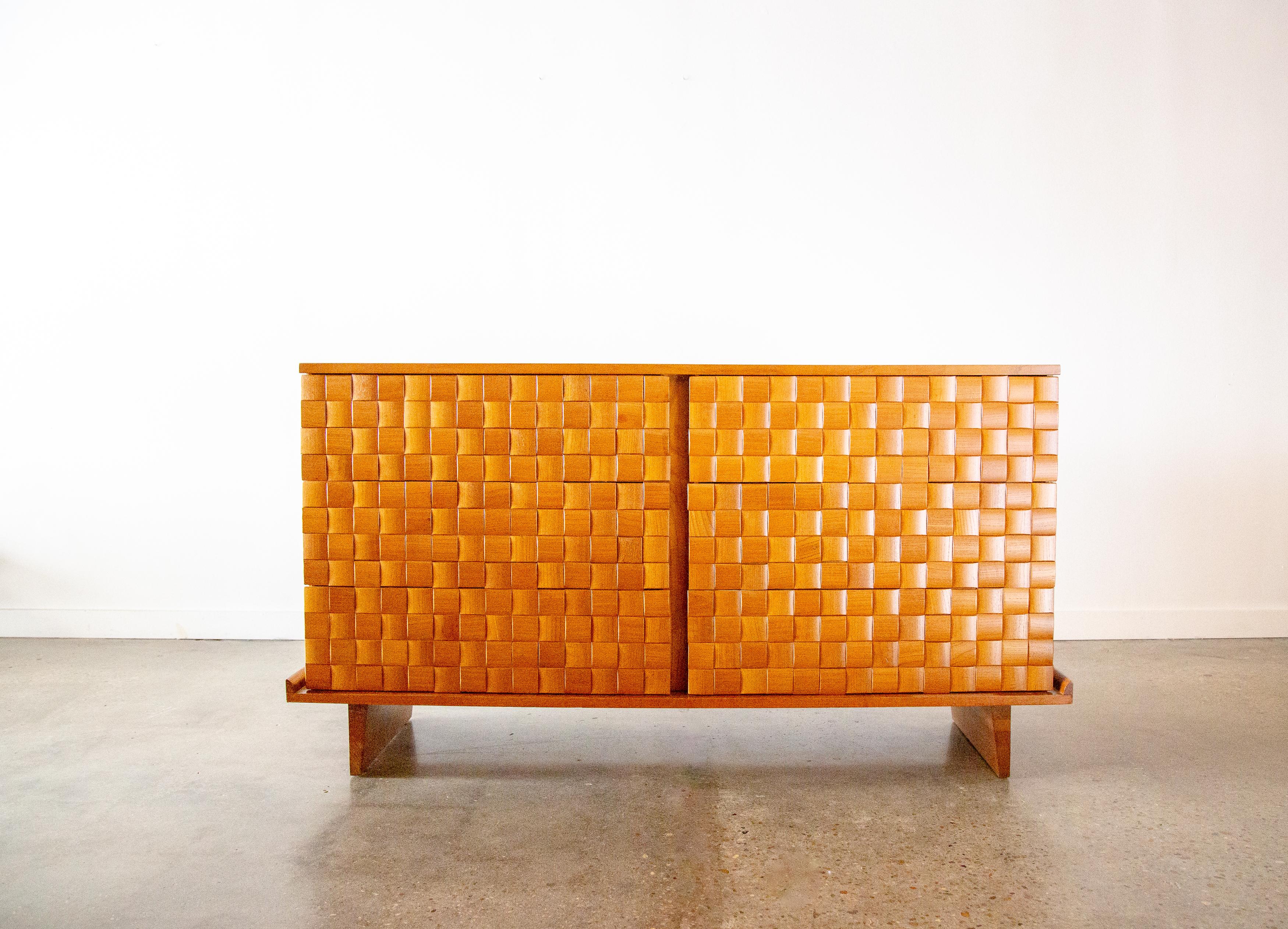 A six drawer chest by Paul Laszlo for Brown Saltman. Oak veneer with 100’s of individual tiles laid in an an interwoven basket weave pattern.  Great texture and warmth. This exceedingly rare cabinet has been recently refinished. The cabinet floats