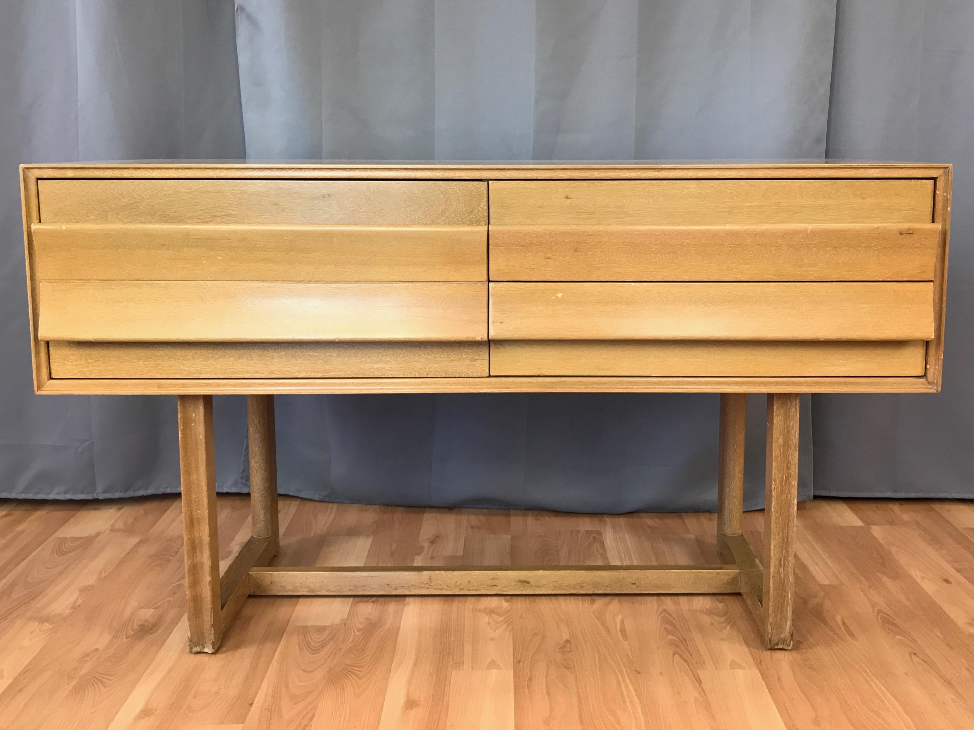 A 1950s mahogany four-drawer buffet or server by Paul Laszlo for Brown-Saltman.

A fairly uncommon piece, made even more so by it being finished in dynamic cerused bleached mahogany. Distinguished by wide drawers with full-front oversized curved