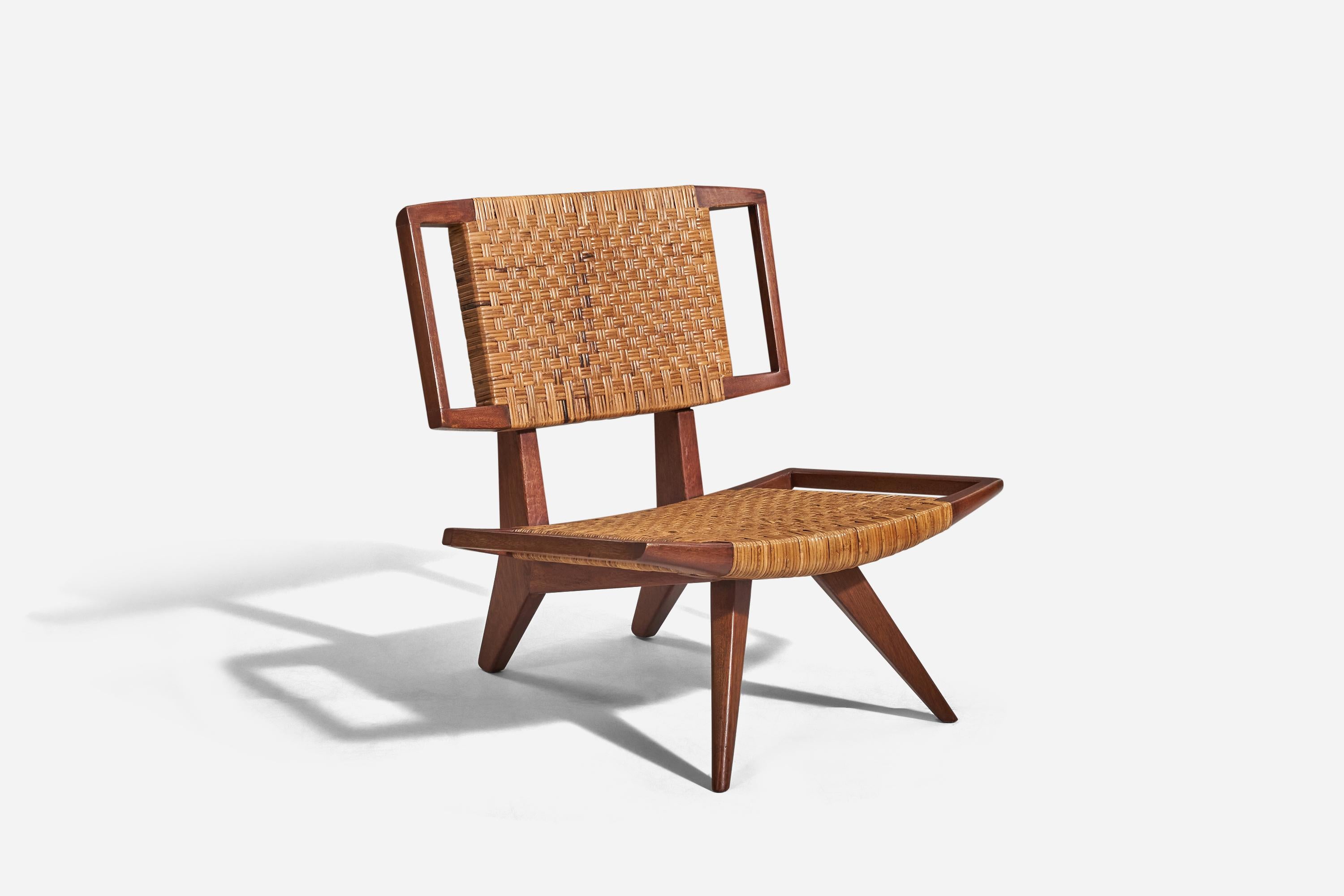A mahogany and rattan lounge chair designed and produced by Paul László, USA, 1950s.