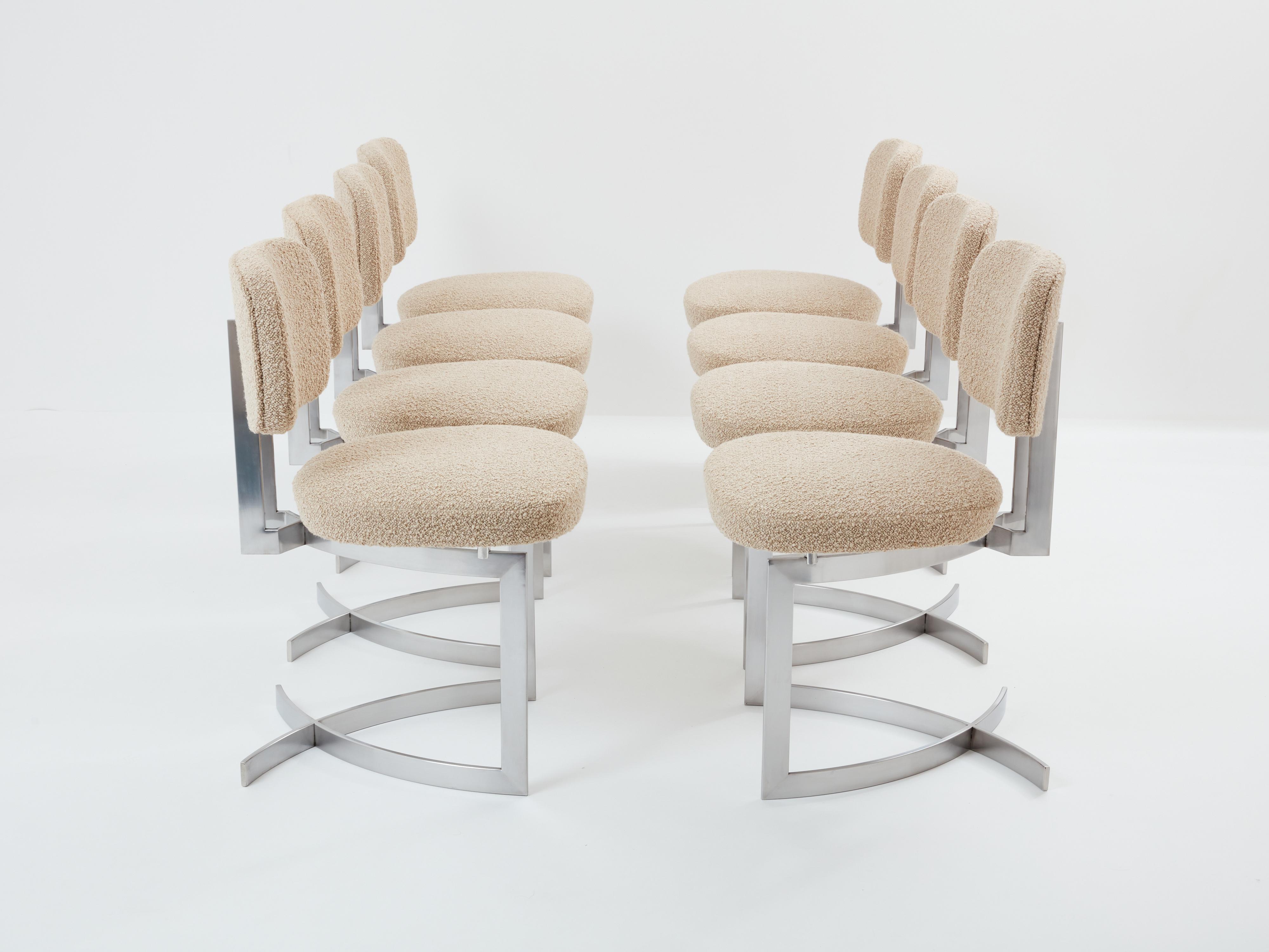 This set of eight chairs, crafted from stainless steel, was designed by the French designer Paul Legeard in the early 1970s. The geometric structure, composed of curved steel blades, supports the seat and back cushions, both reupholstered with a