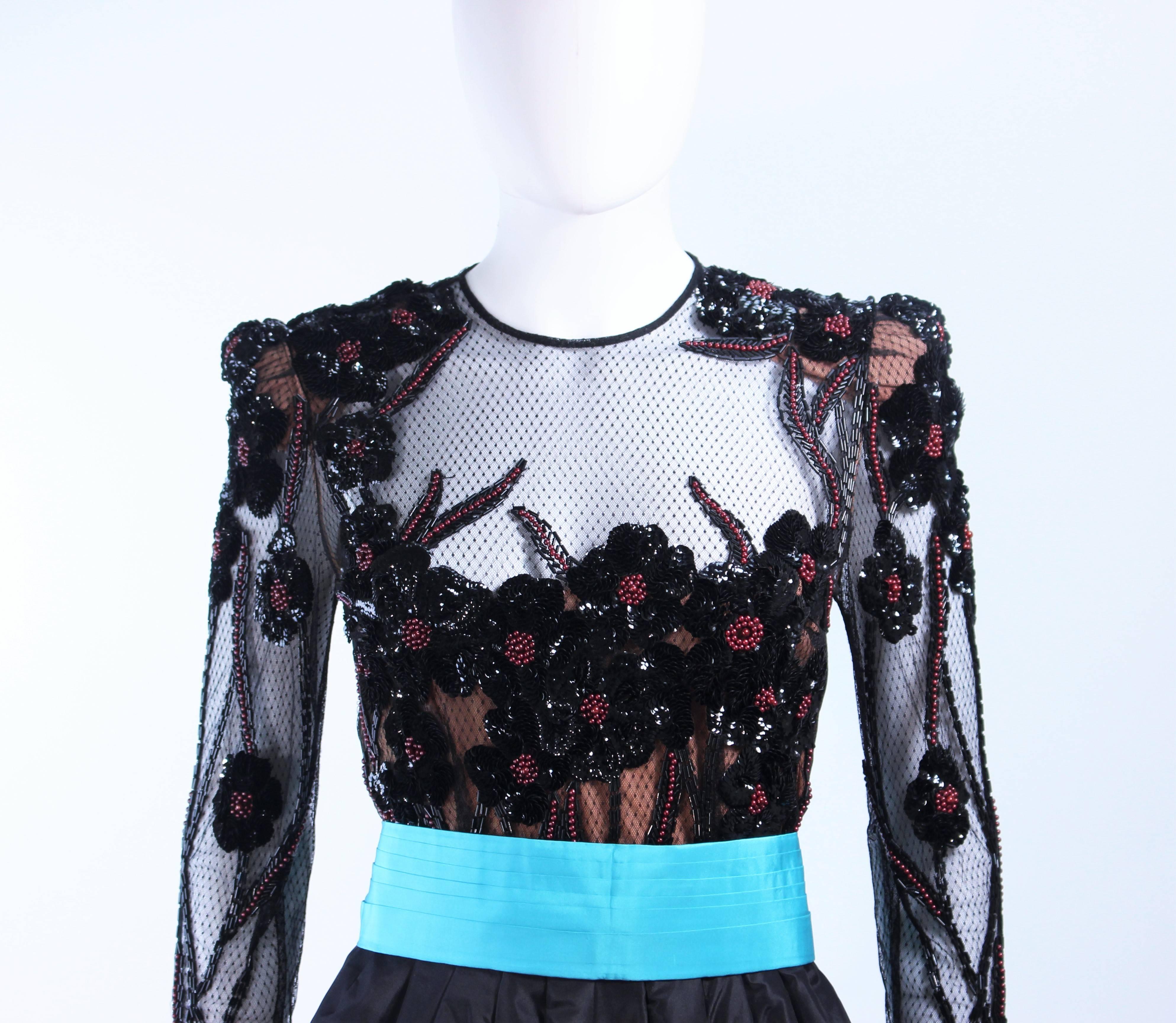 This Paul Louis Orrier cocktail dress is composed of a black silk with sequin applique bodice. Features a silk turquoise belt and skirt interior. there is  a center back zipper closure. In excellent vintage condition.

**Please cross-reference