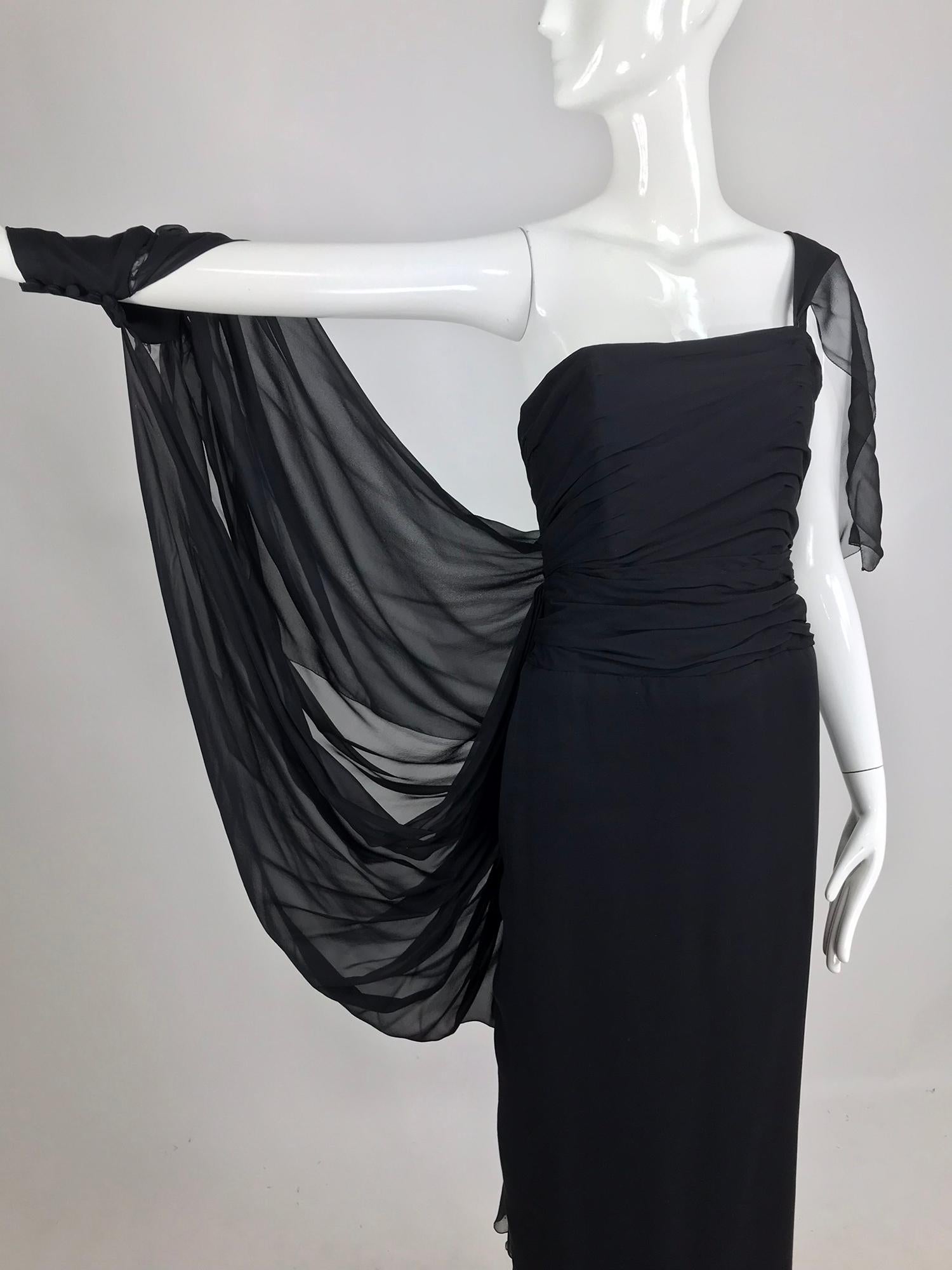 Paul-Louis Orrier black silk chiffon one sleeve demi couture gown from the early 1980s.  Orrier may be better known for his 80s poof and glitter confections, but this dress done in silk chiffon shows command of a notoriously difficult to work with