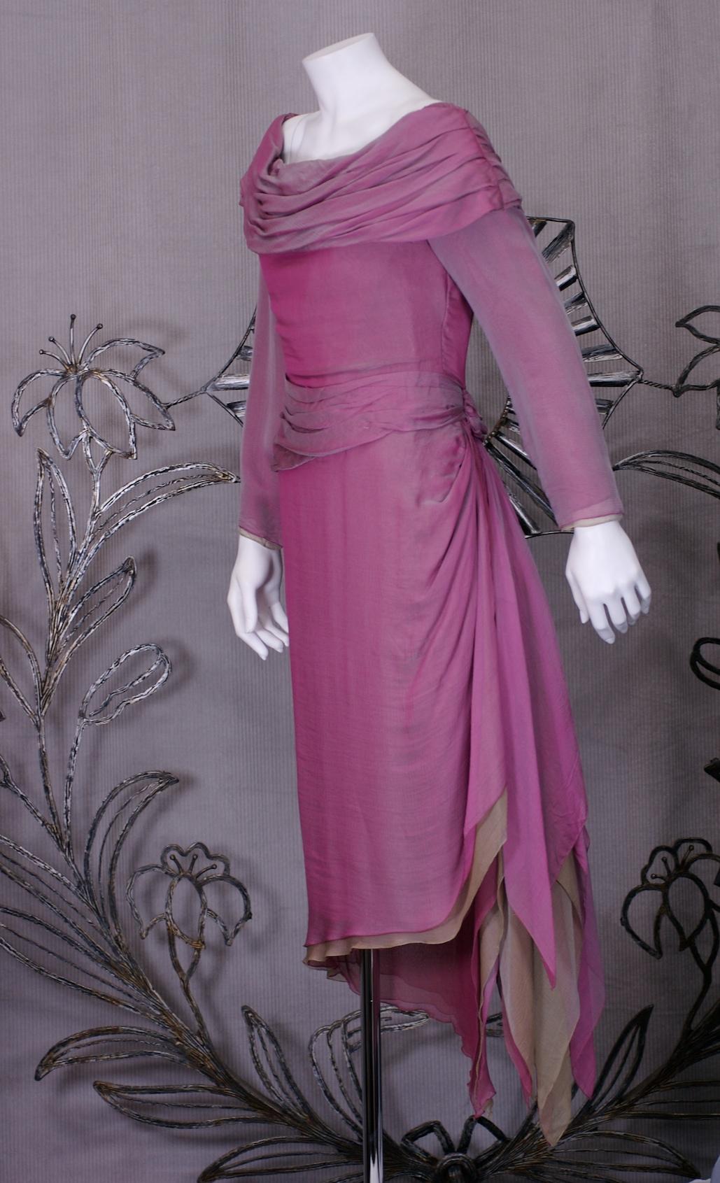 Lovely and elegant Paul Louis Orrier Cocktail Dress made with 2 layers of silk chiffon, the first in changeant rasberry overlaid on top of a pale coffee chiffon. Draped off the shoulder neckline with fitted bodice, draped waist and long sleeves. The