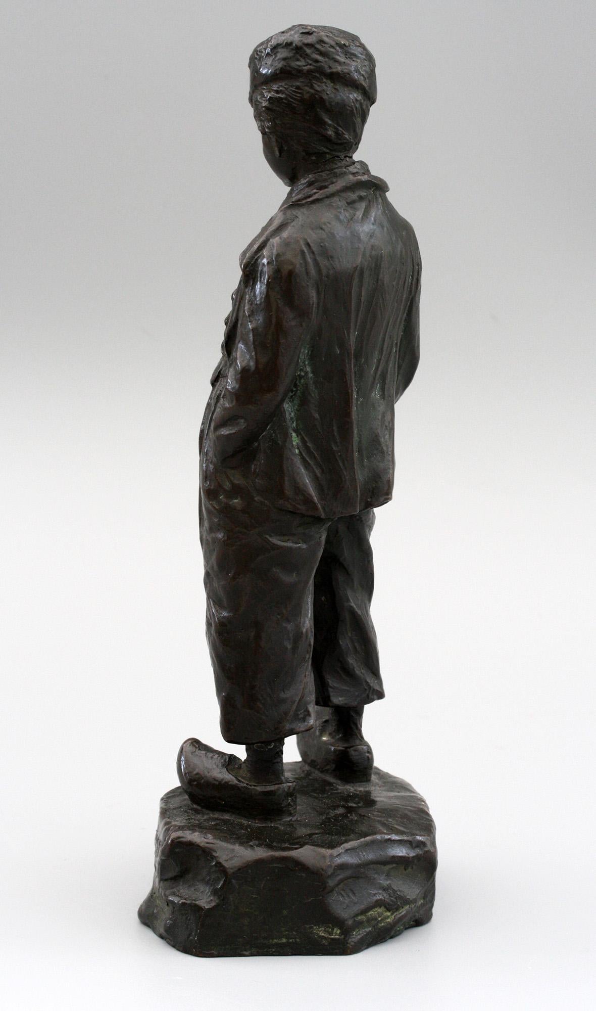 A very stylish and well sculpted bronze figure of a Cossack wearing clogs by renowned Polish sculptor Paul Ludwig Kowalczewski (1865-1910) dating from circa 1890. The sculpture is cast depicting a man in traditional costume and wearing a fur hat