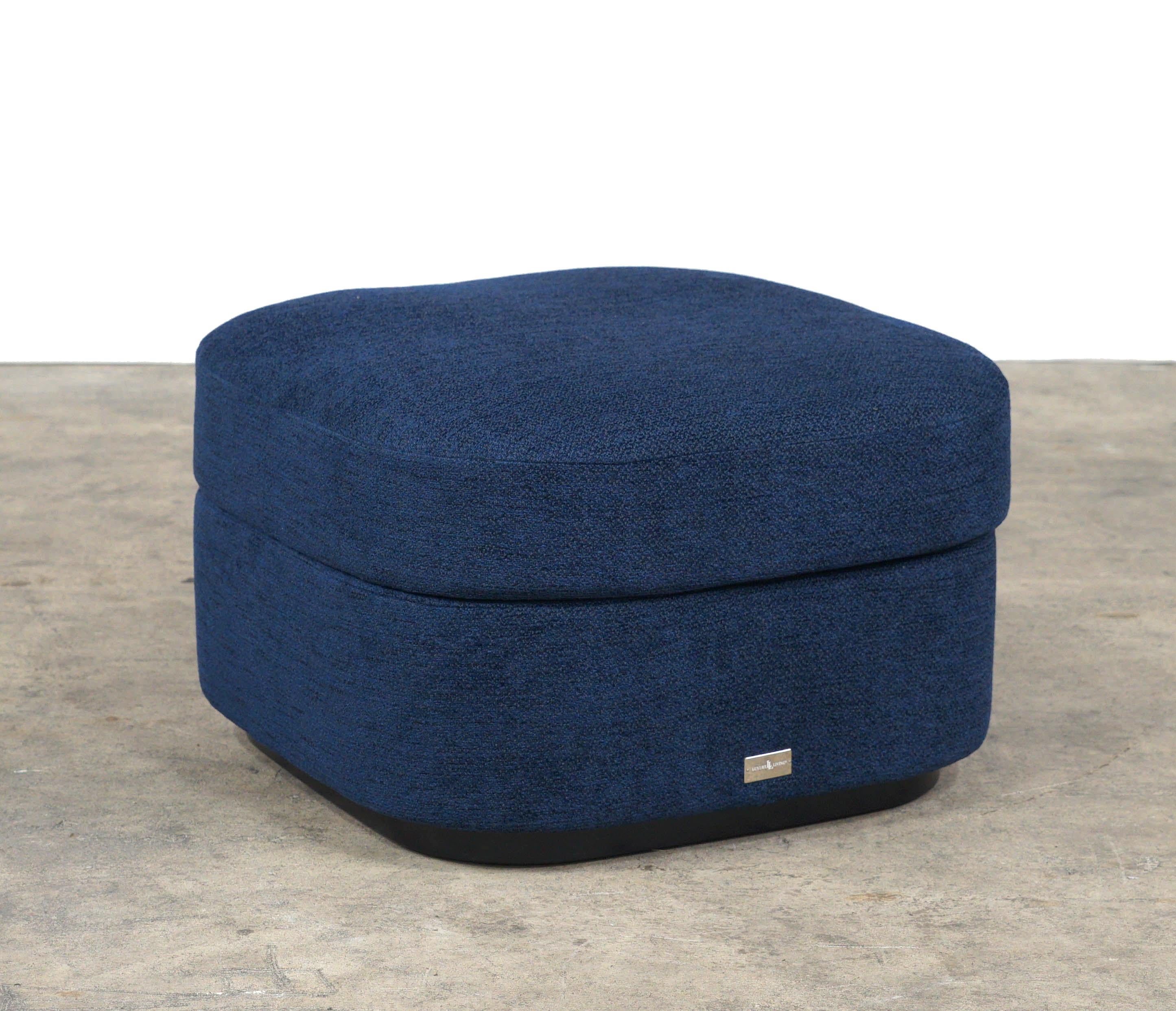 The Contour Club is a chic pair of ottomans that can add instant flare and additional seating to any environment. They are upholstered in navy blue boucle fabric with a removable top cushion. 
 