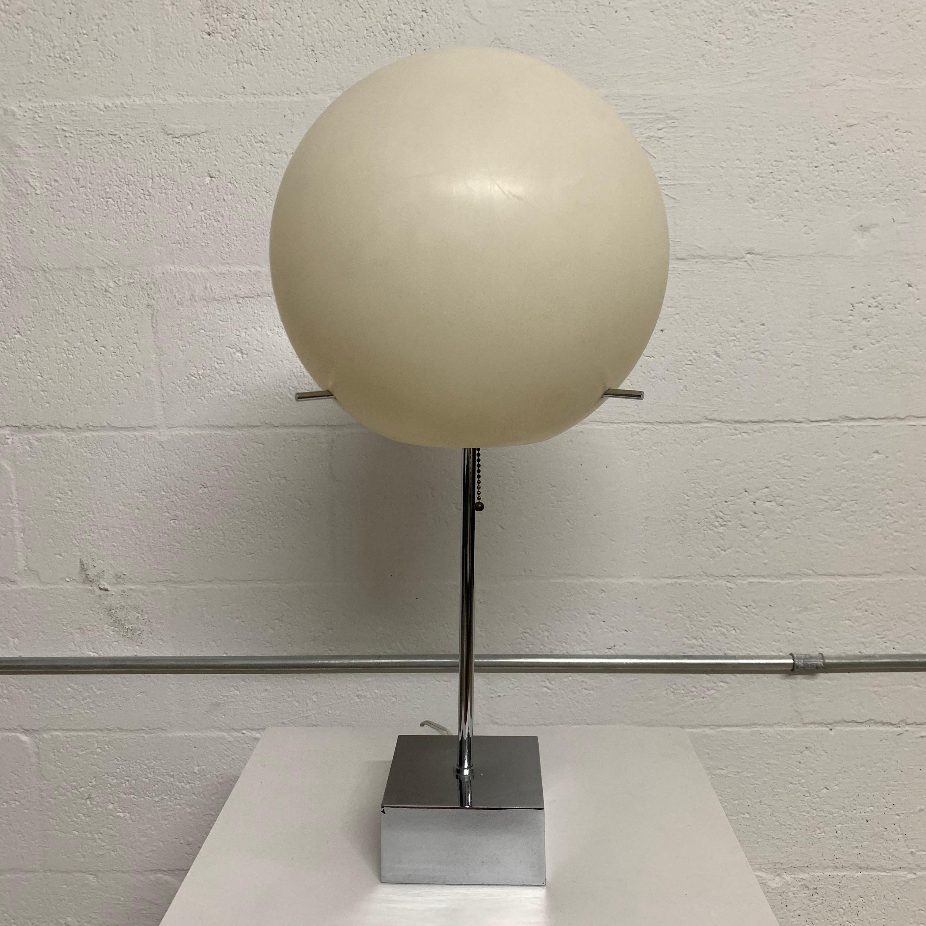 Iconic globe lamp rendered in chrome-plated steel white a white polyurethane globe suspended by three chrome rods designed by Paul Mayen for Habitat, UK, 1970s.