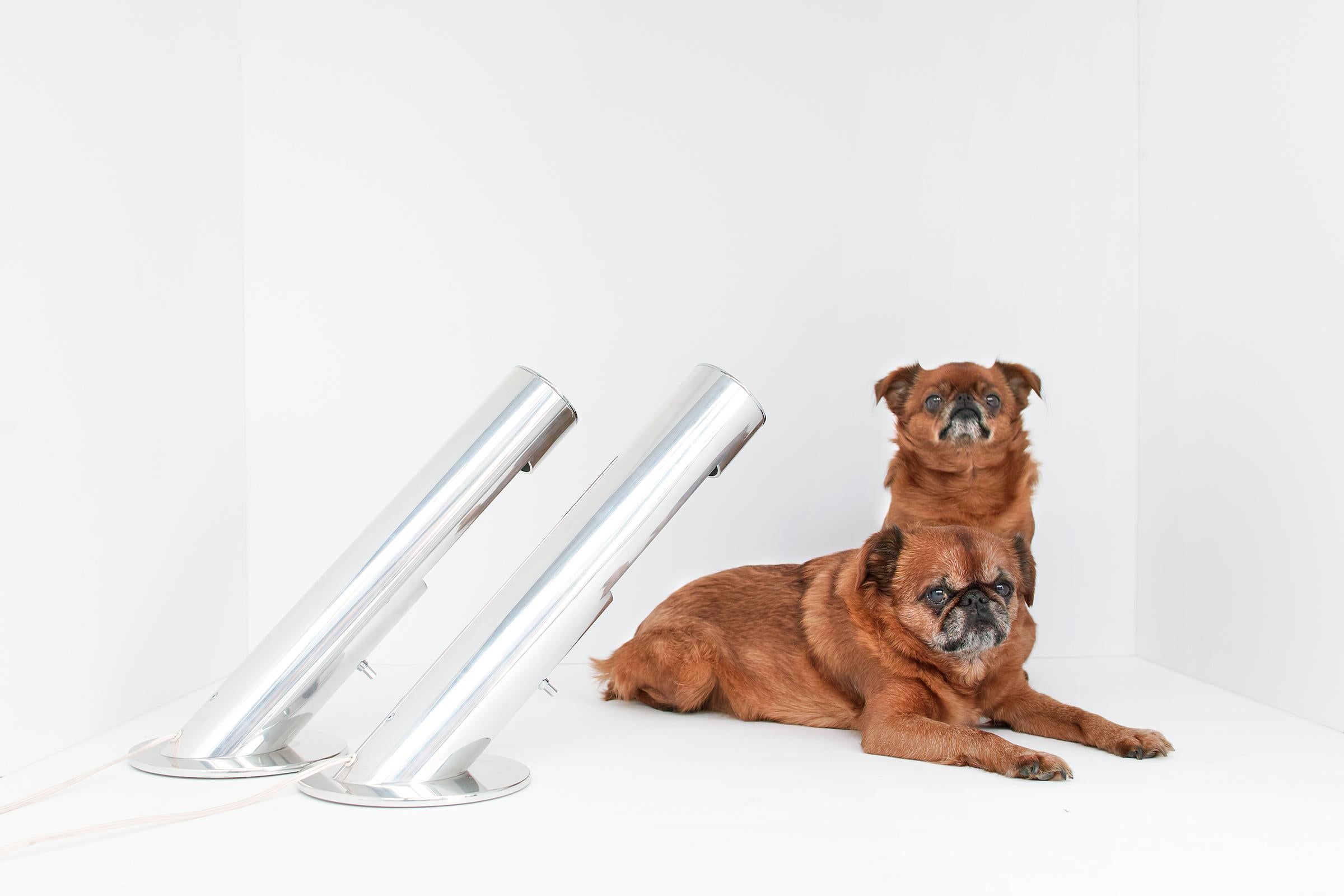 For your consideration is this pair of modern, angled, aluminum cylinder lamps by Paul Mayen for Habitat which feature clean modern forms, original porcelain sockets, original six-sided metal rotary switches, and mirror-like polished aluminum