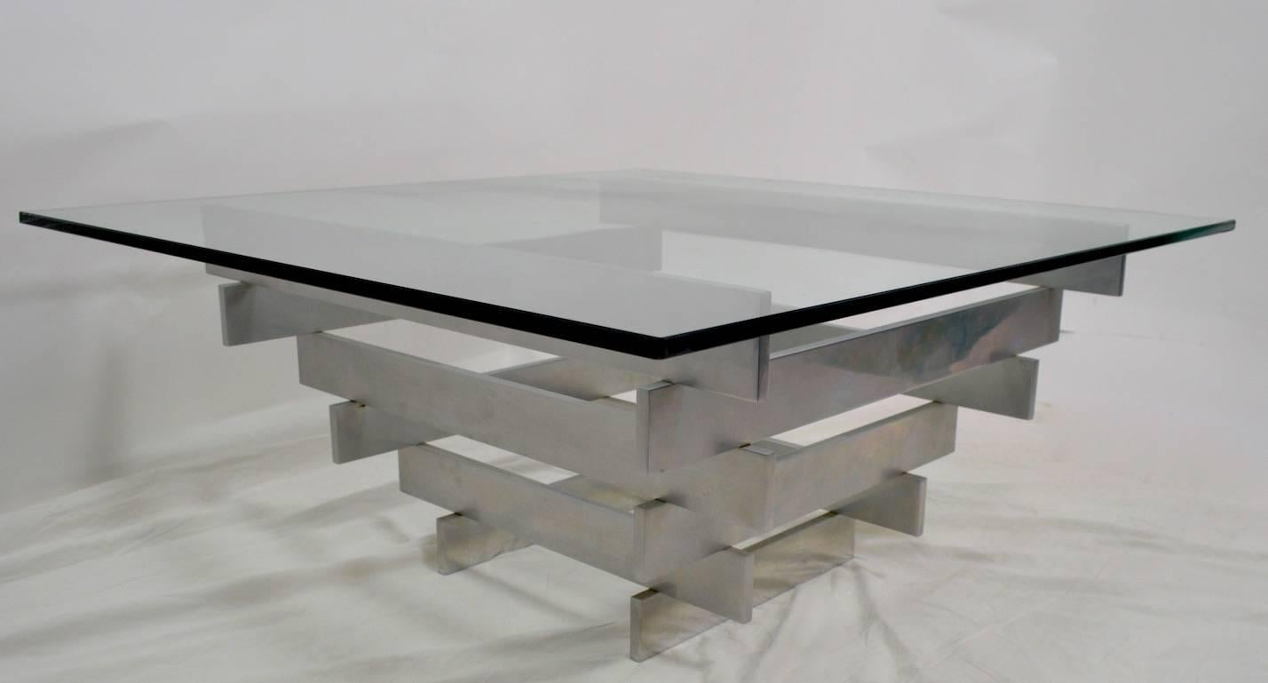 Plate glass top rests on stacked aluminium block form elements. Clean, original, ready to use condition, original thick
( .50 inch ) plate glass top, aluminium base in original finish. Minimalist international style sophisticated and chic table.