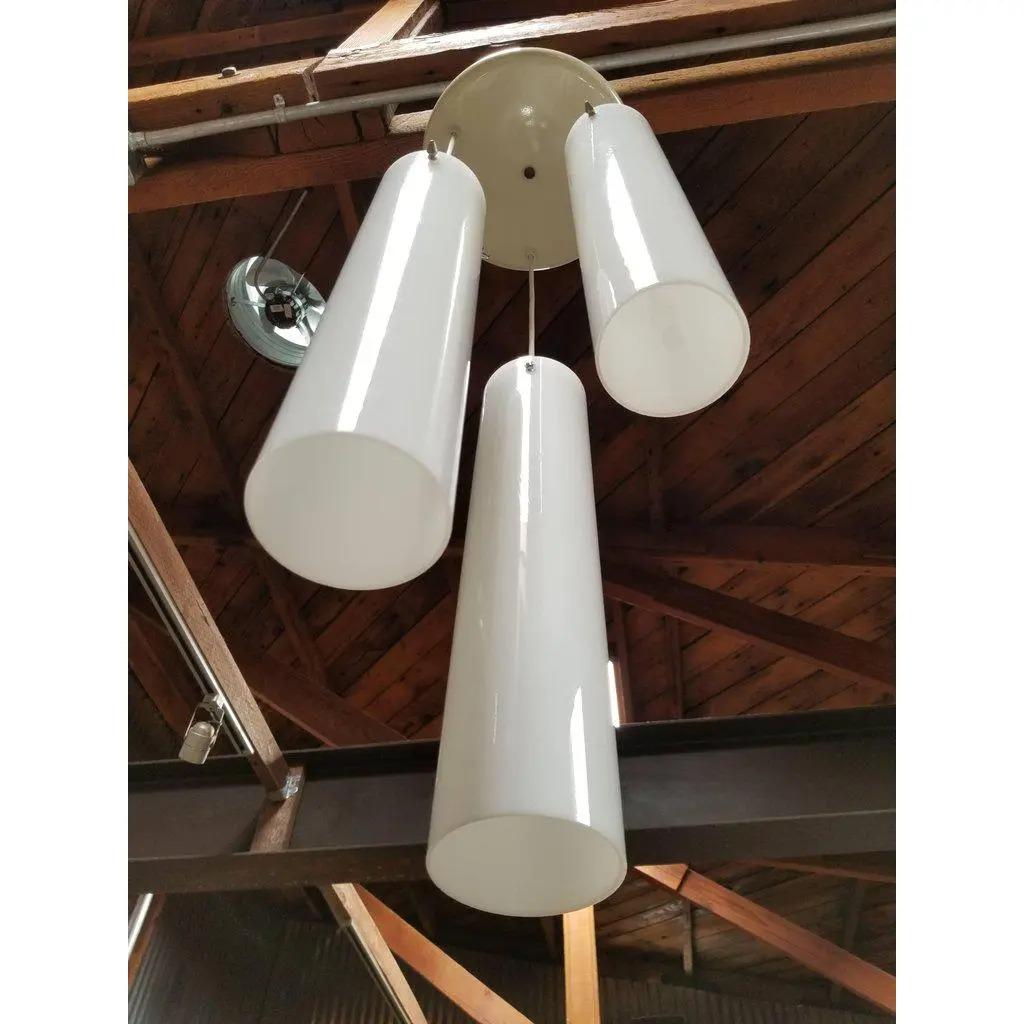 A Paul Mayen cylindrical glass and painted steel ceiling fixture. Each glass shade measures 4