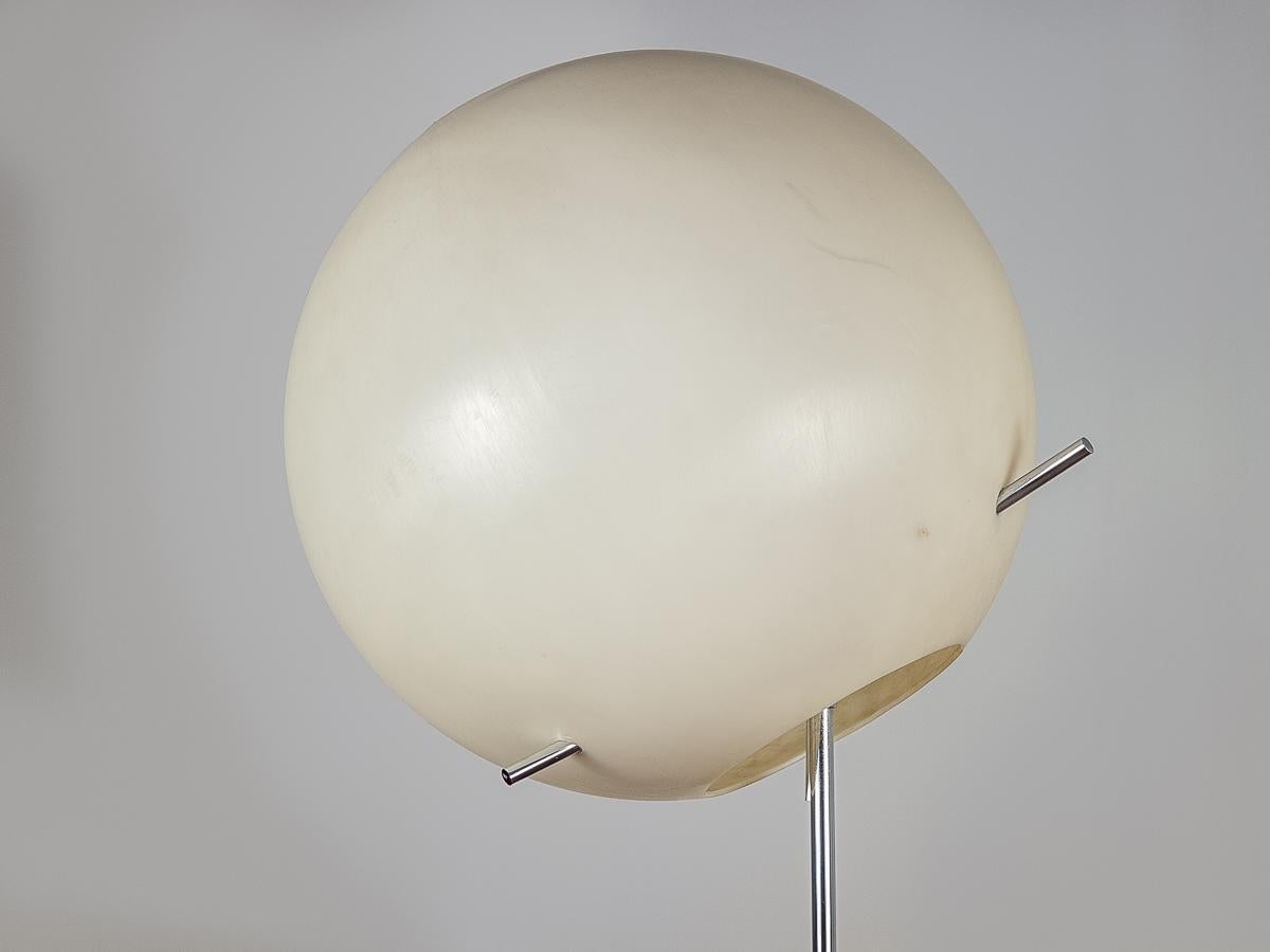 Midcentury floor lamp designed by Paul Mayen for Habitat with the travertine base. Acrylic globe has three chrome rods that attach to the neck of the lamp. Original chrome pull turns the lamp on and off. Shade is adjustable for different angles. The