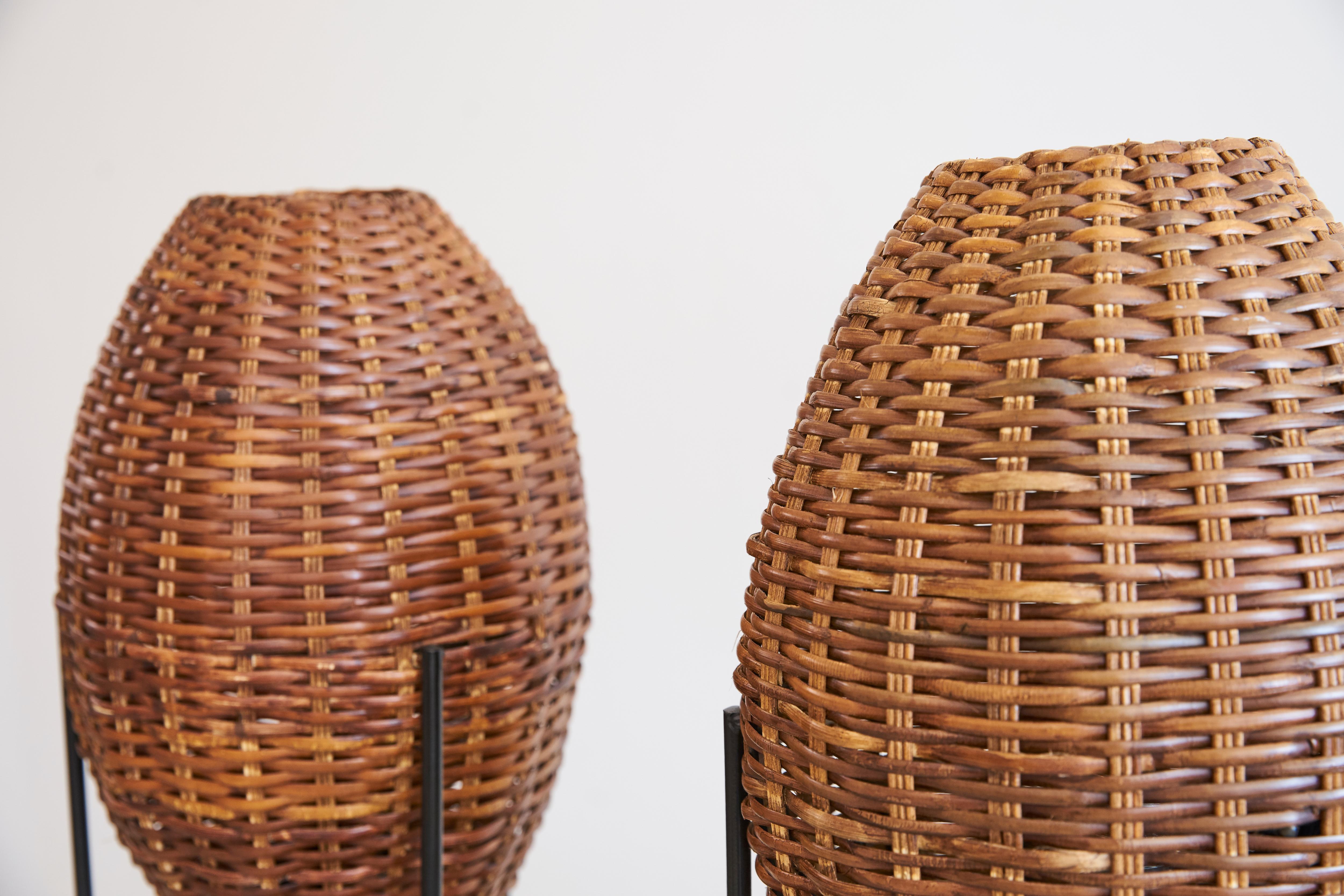Pair of woven rattan lights attributed to Paul Mayen with iron hairpin leg.
Newly rewired.