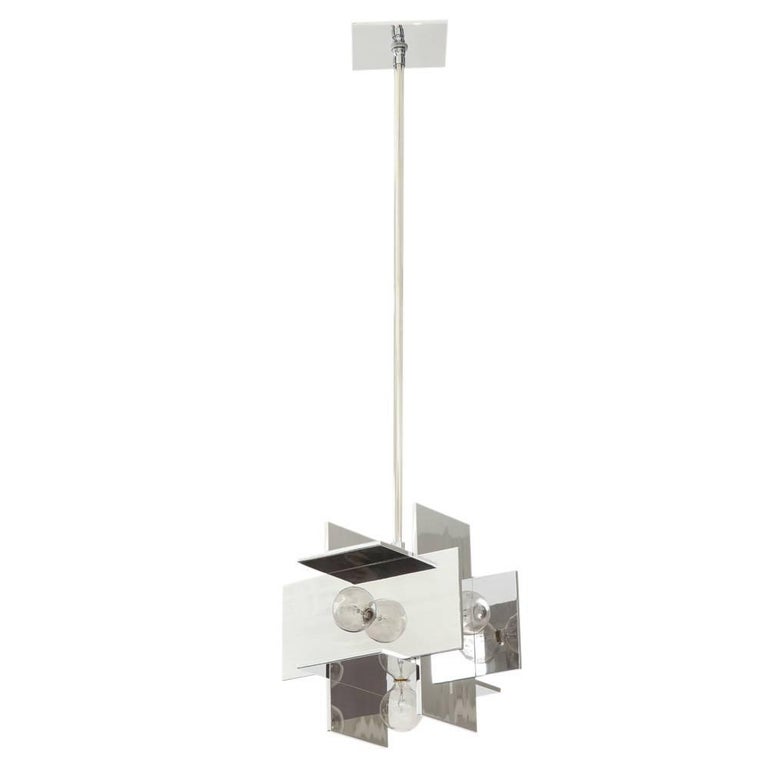 Paul Mayen multi-reflector pendant lamp, polished aluminum. Small hard edge geometric form pendant lamp which the 1973 Habitat Catalogue identifies as Style #30231. Takes five bulbs - 25 watts recommended. Fitted with a new square canopy and 24 inch
