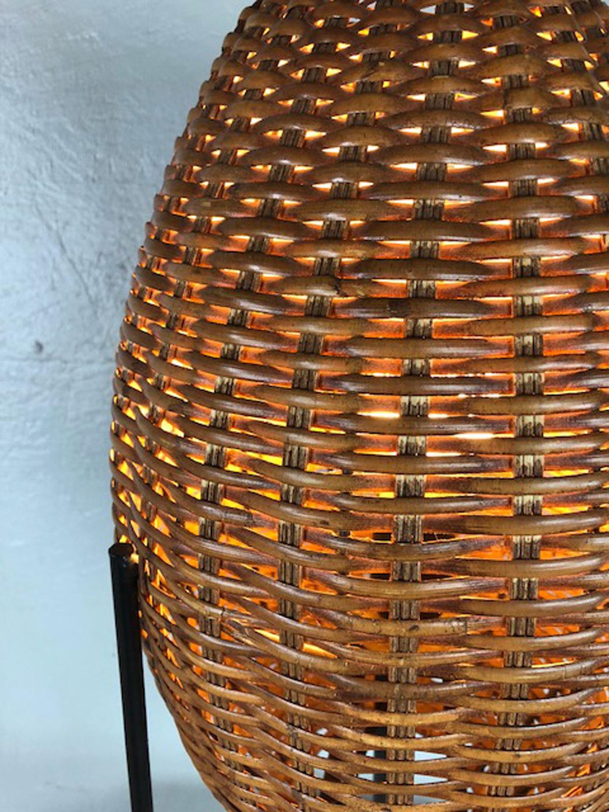 Paul Mayen rattan woven table lamp with iron hairpin leg, circa 1950s.
 