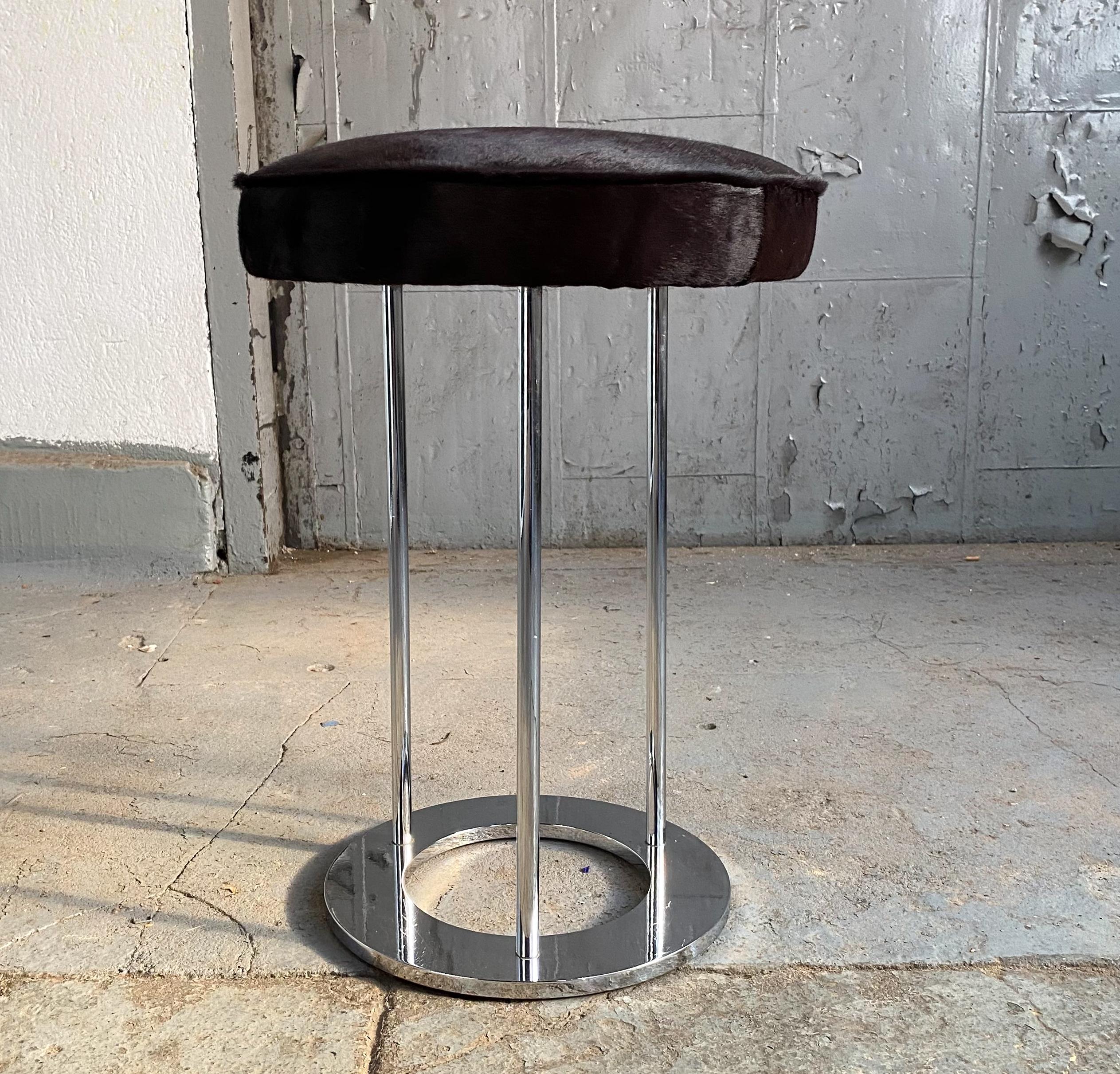Stool with polished chrome risers and a newly upholstered seat in animal hide. Designed by Paul Mayen and produced by his company, Habitat, circa 1960s. A seldom seen item from this underrated designer whose Minimalist lighting and furnishings