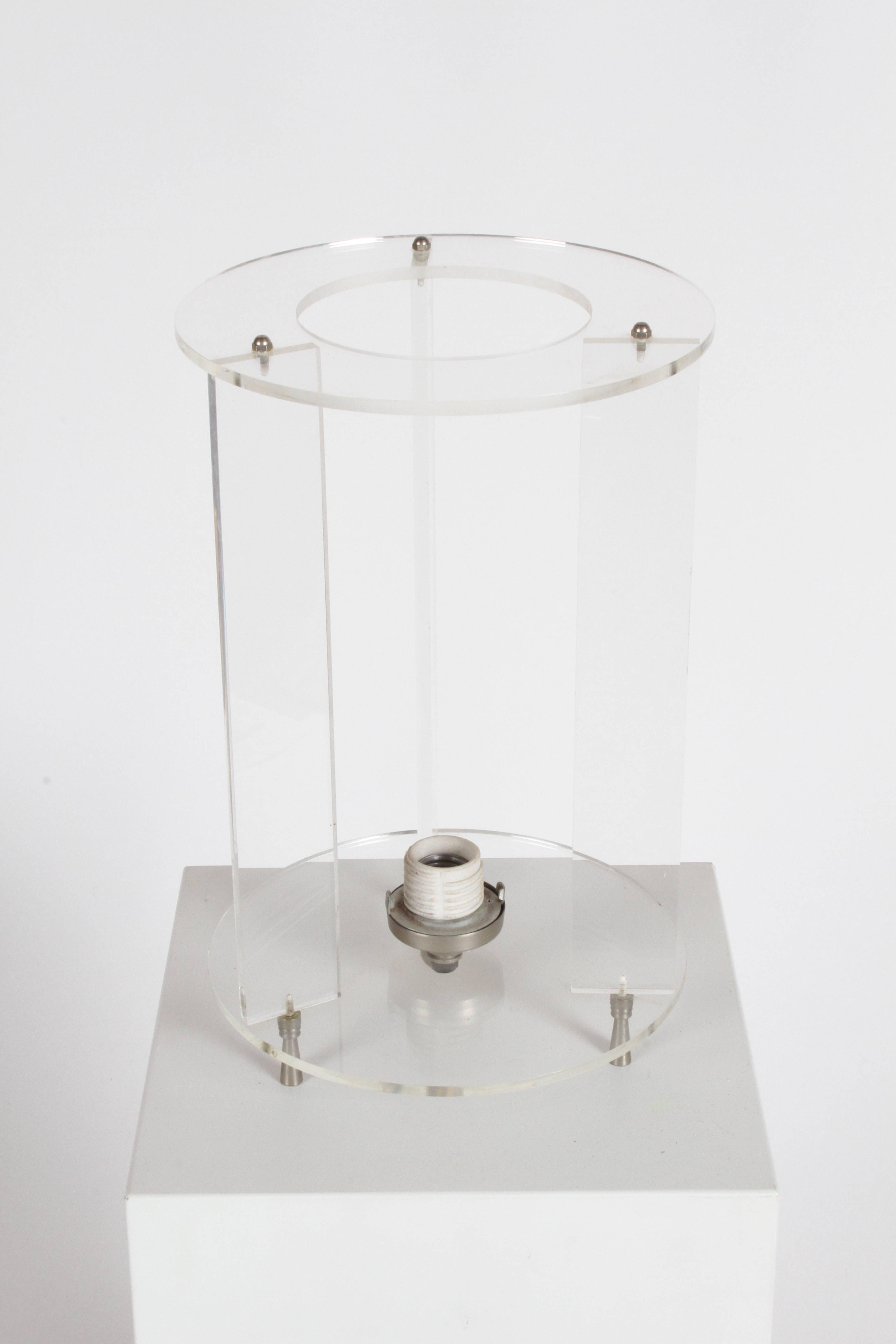 Mid-Century Modern Paul Mayen style cylinder Lucite and glass table or desk lamp on raised tapered feet.