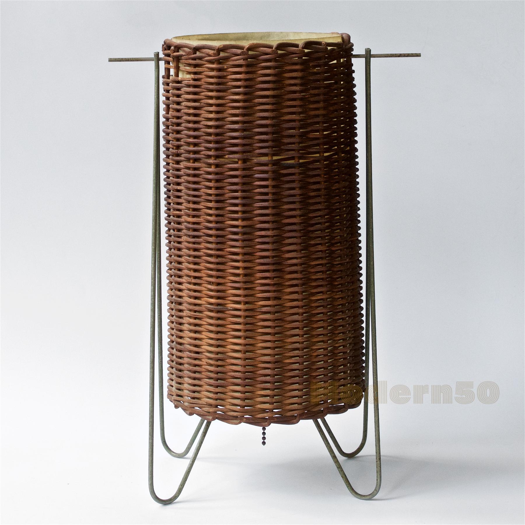 Presented in as-found condition, and fully functional. A rare Paul Mayen design, wicker wrapped soft fiberglass lantern cylinder, in rocking wire cradle. This lamp was distributed by Nardin + Radoczy of NYC, and selected for the Fall 1951 MoMA Good