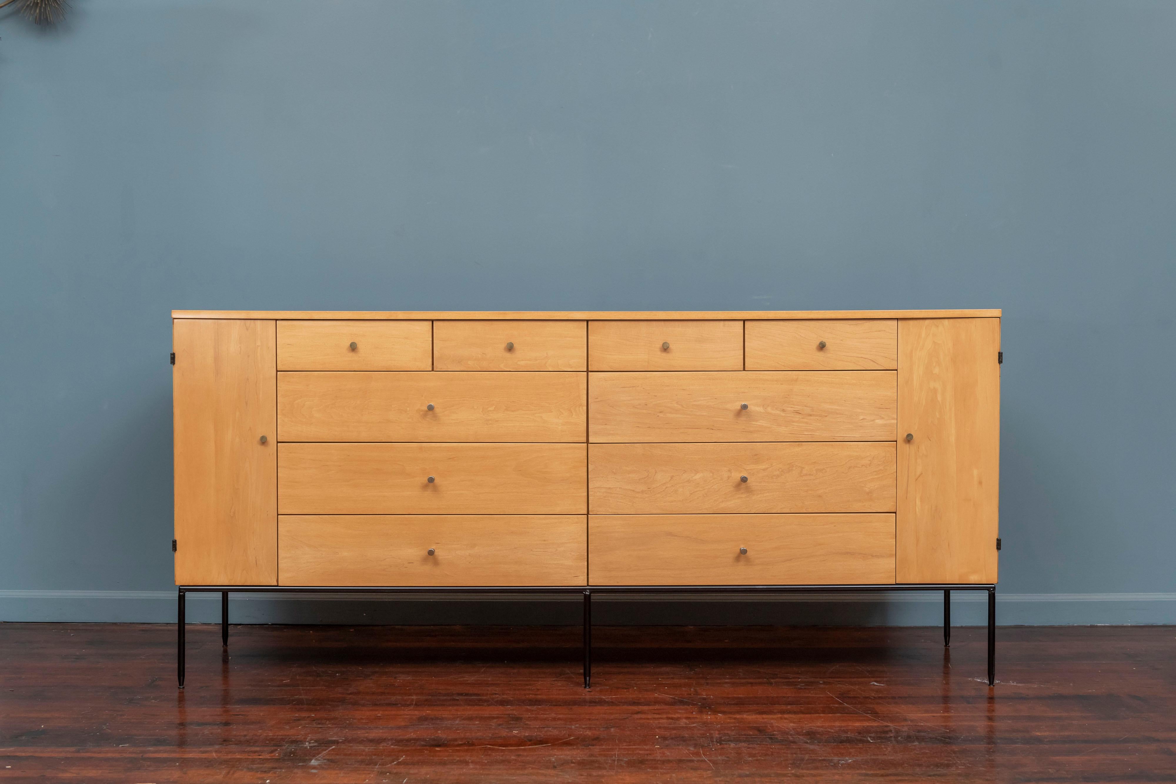 Paul McCobb design 20 drawer dresser for his Planner Group line produced by Winchendon, Massachusetts. Rare early example in solid maple with a lacquered steel six leg base and original hardware, newly refinished and ready to be installed.