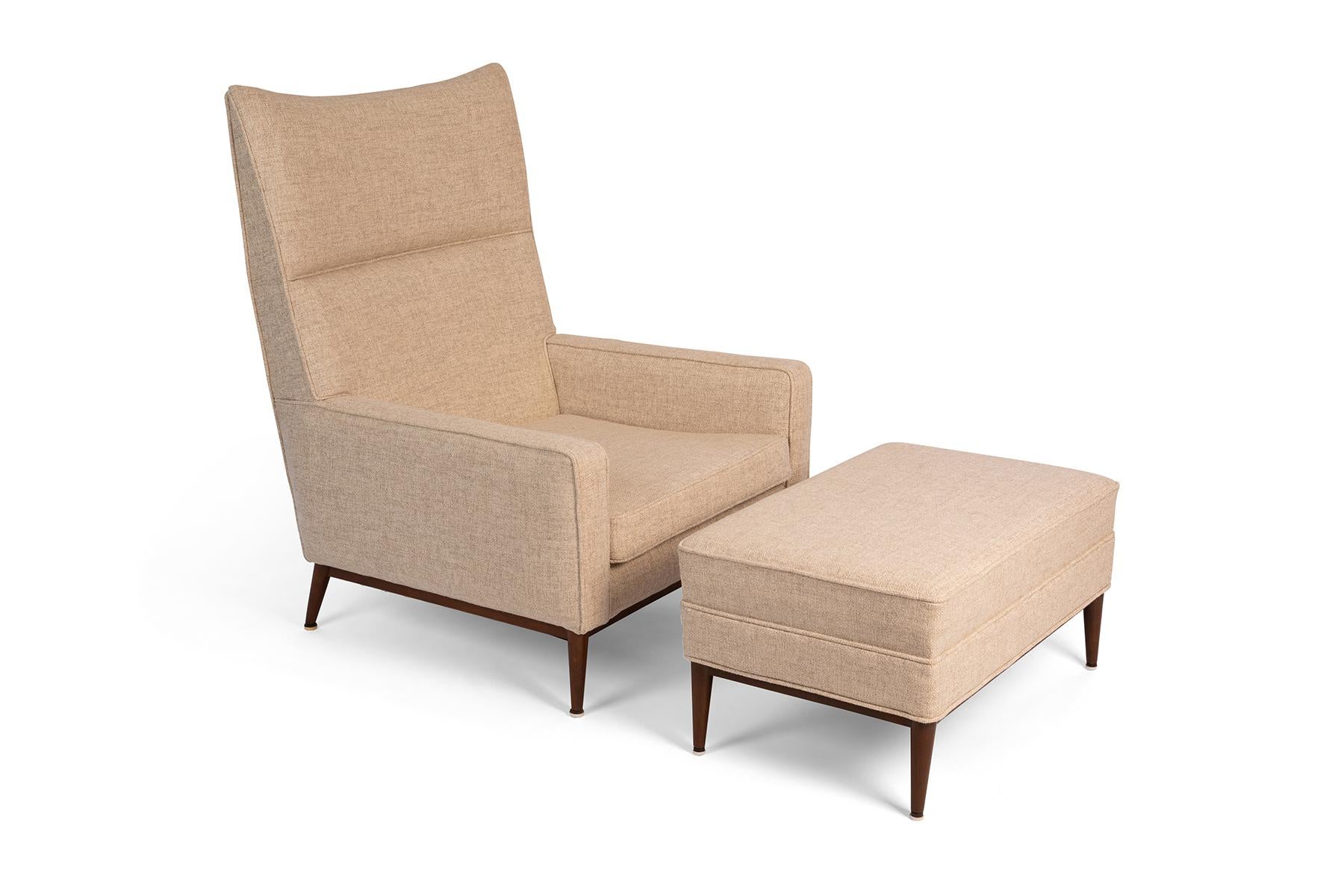 Paul McCobb 314 lounge chair with accompanying ottoman in an off-white Holly Hunt wool accented with newly finished solid walnut legs. Ottoman measures 29.5 x 19 inches.