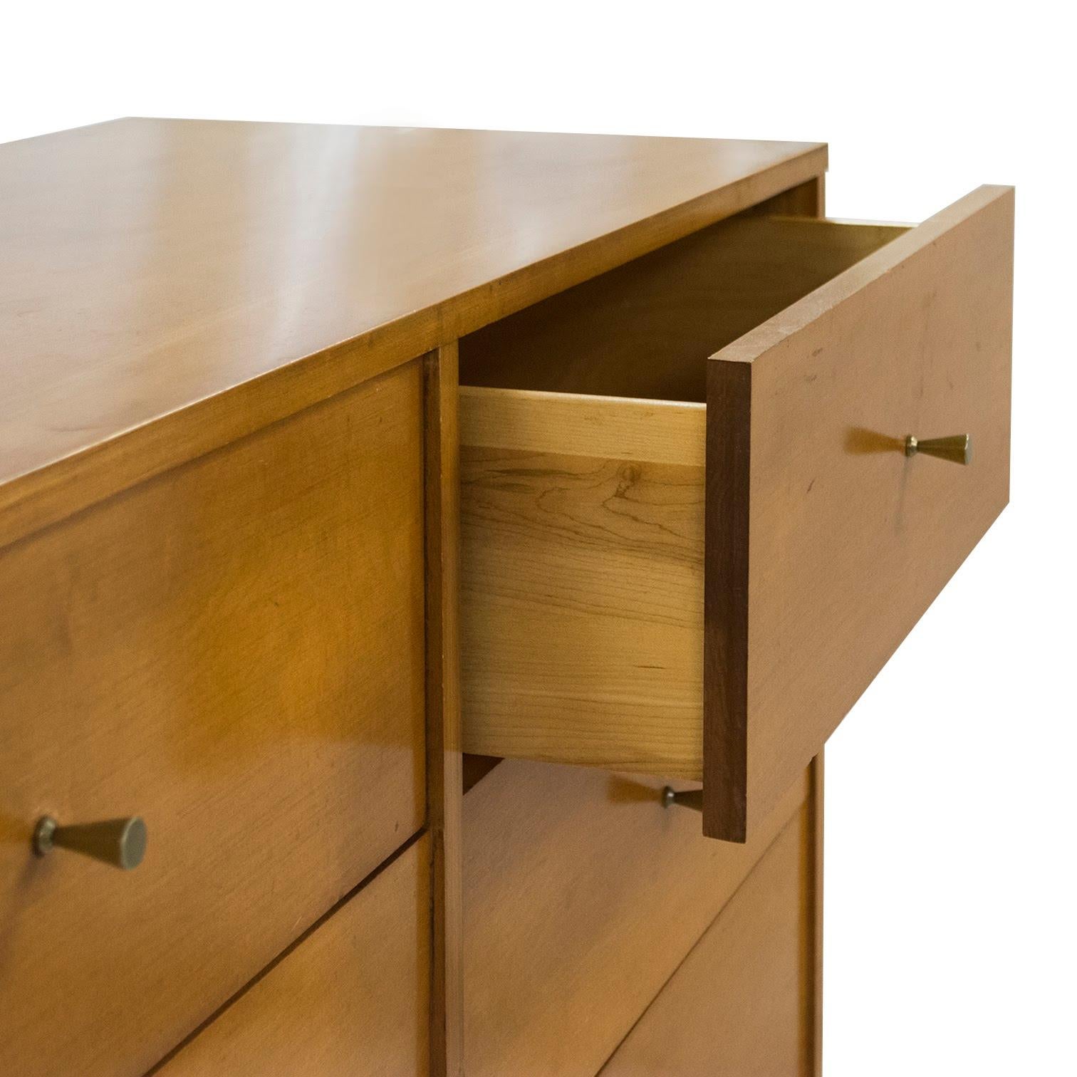 Perfect for apartment living this compact (48in) dresser, designed by the great Paul McCobb in his Planner Group. McCobb, influenced by the English designer Thomas Sheridan used delicate designs featuring tapered legs and well executed