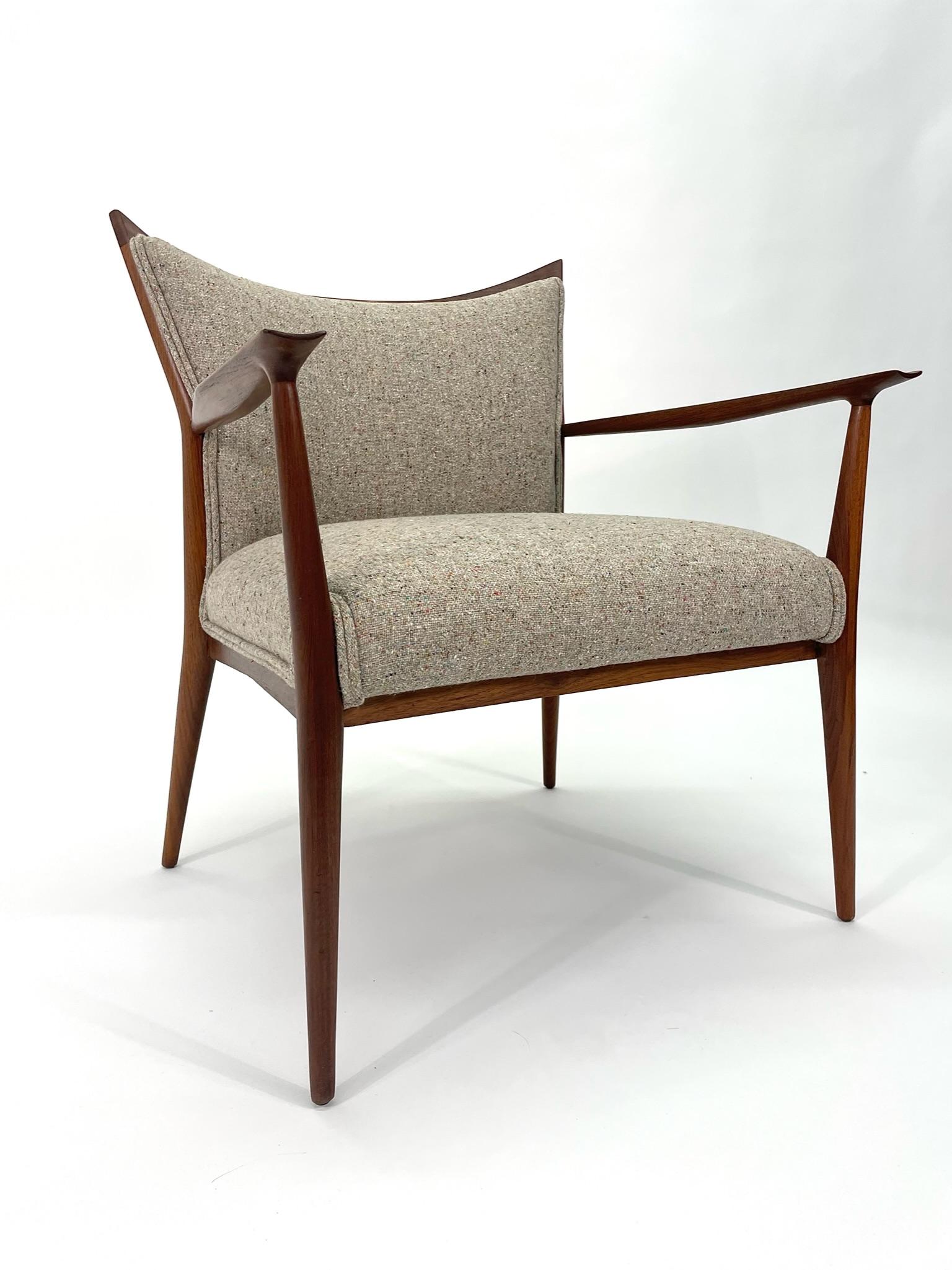 This is a rarely seen Paul McCobb Armchair for Directional. This elegant chair features a solid walnut frame with the most elegant curved backrest, curved fronts legs, and arms. It is a seriously comfortable chair, marrying form and function