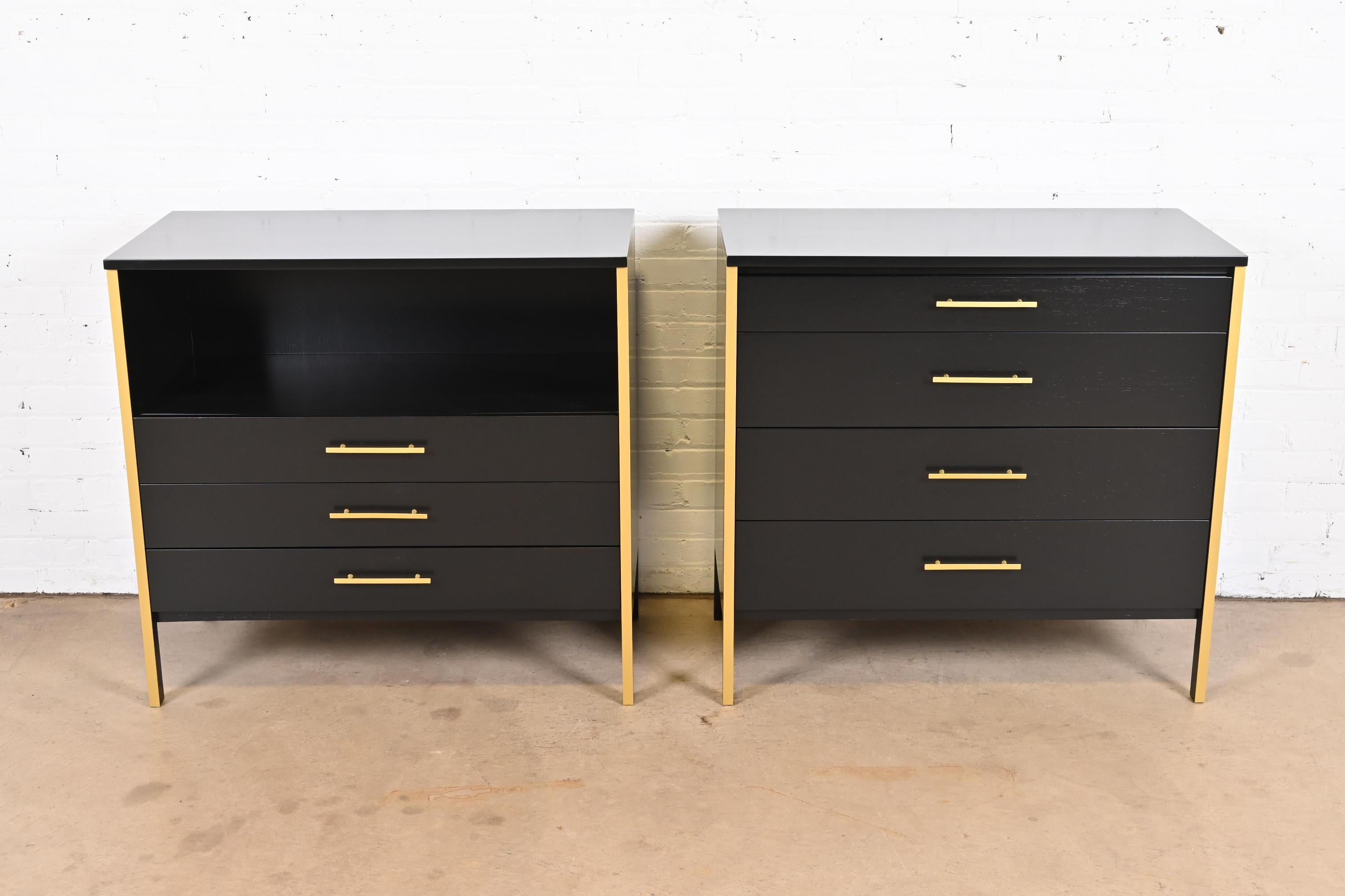 An exceptional pair of Mid-Century Modern dressers, chests of drawers, or oversized bedside chests

By Paul McCobb for Calvin Furniture

USA, 1950s

Black lacquered walnut, with brass finished trim and hardware. One with four drawers, and the