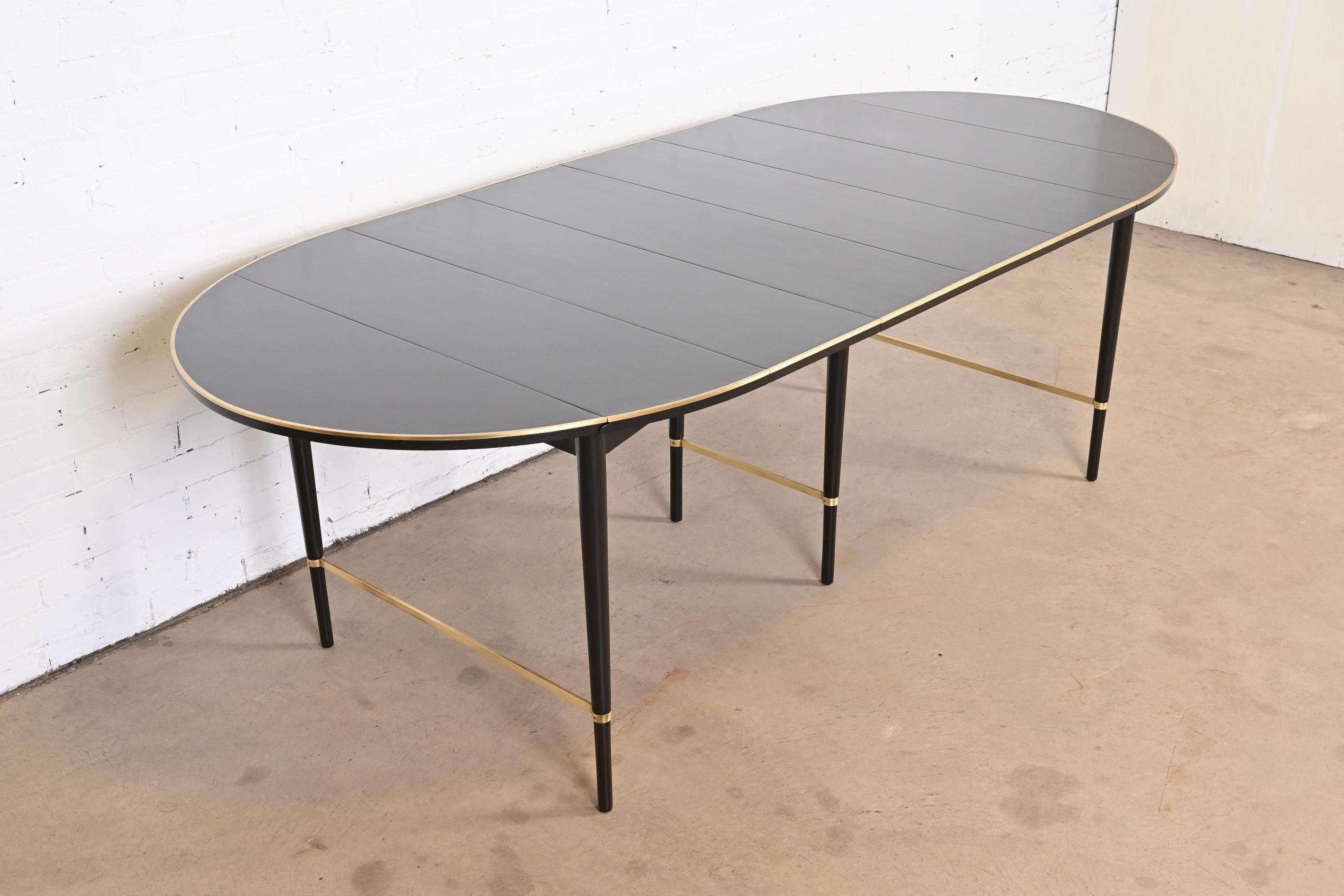 A rare and exceptional Mid-Century Modern extension drop leaf dining table

By Paul McCobb for H. Sacks & Sons, 