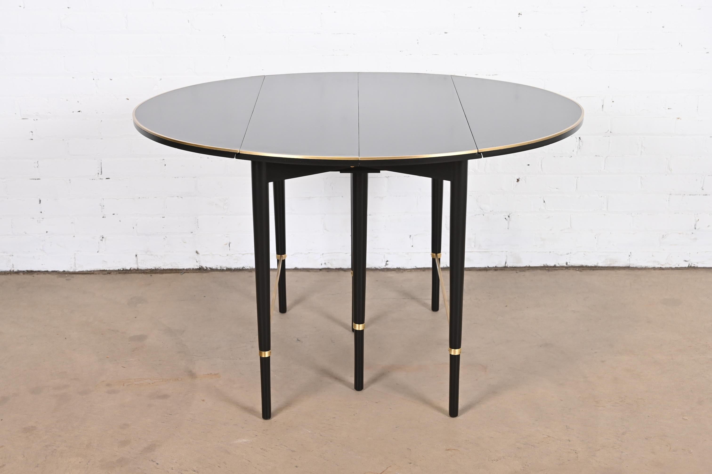 Mid-20th Century Paul McCobb Black Lacquer and Brass Extension Dining Table, Newly Refinished For Sale