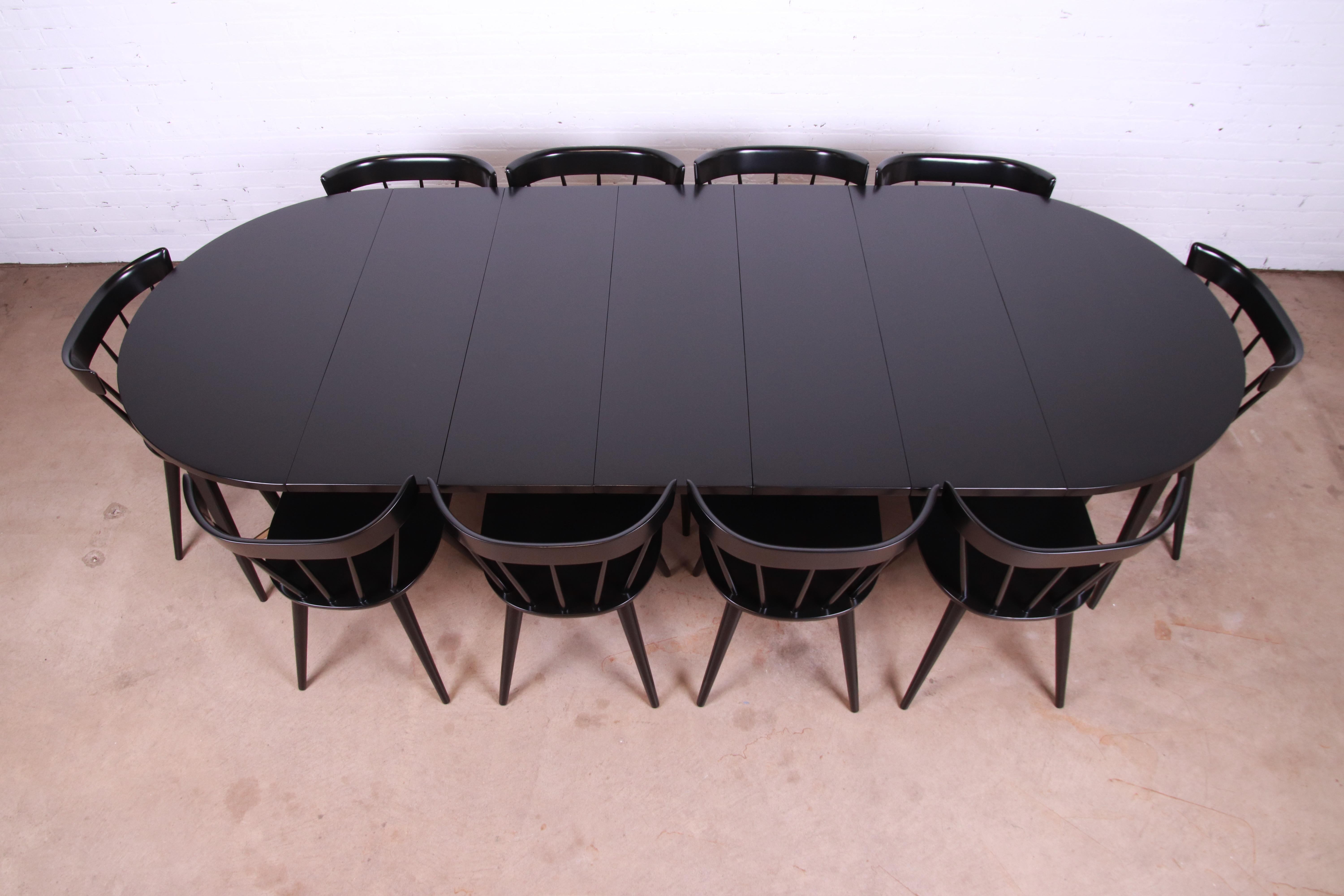 An exceptional and very versatile Mid-Century Modern extension dining table with a set of ten spindle back chairs

By Paul McCobb

The table is from the 