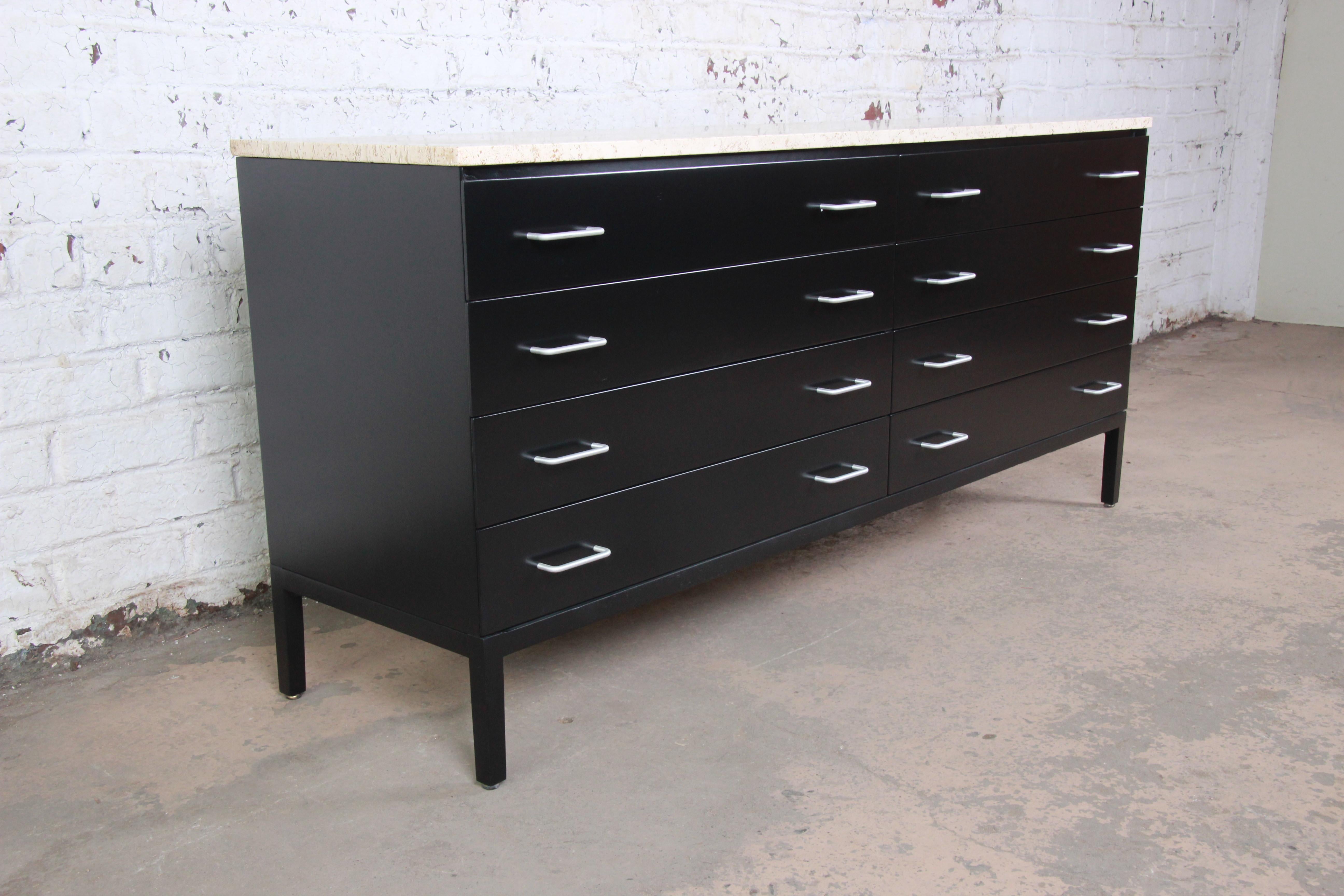An exceptional Mid-Century Modern eight-drawer double dresser or credenza

By Paul McCobb for Calvin Furniture

USA, 1950s

Black lacquered walnut and aluminum hardware and travertine top

Measures: 71.38
