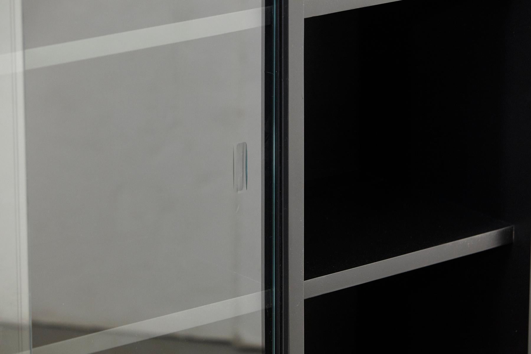 American Paul McCobb Bookcase in New Black Finish with Sliding Glass Doors on Iron Base