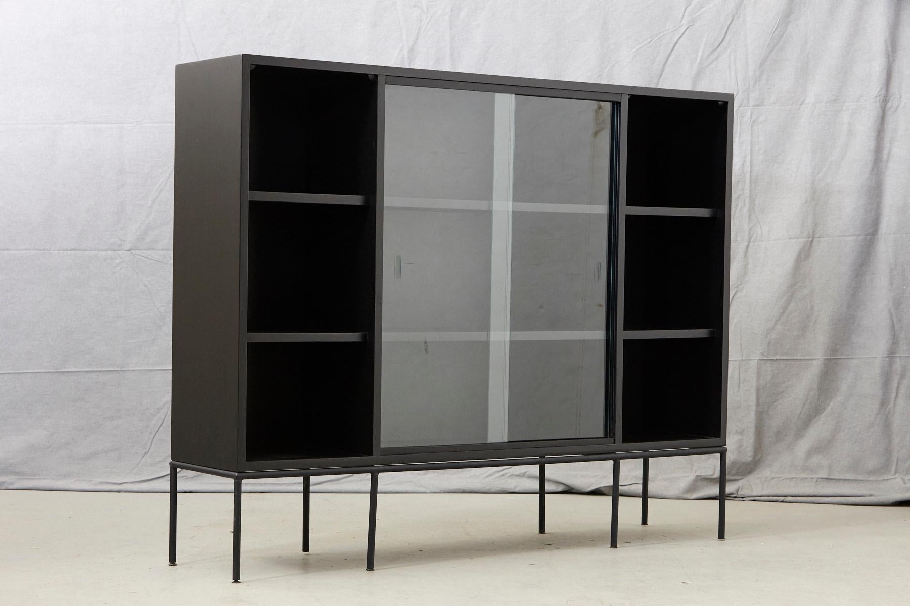 Lacquered Paul McCobb Bookcase in New Black Finish with Sliding Glass Doors on Iron Base