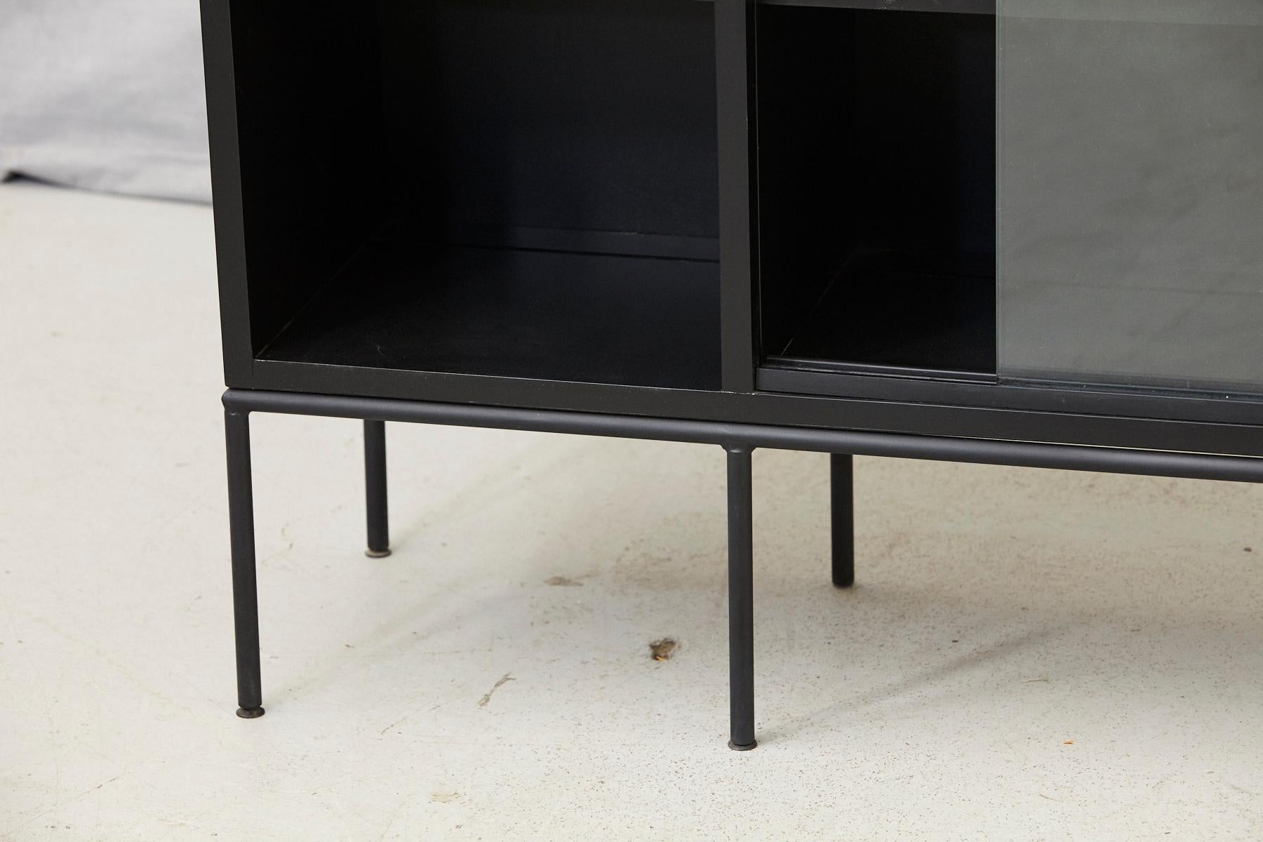 Steel Paul McCobb Bookcase in New Black Finish with Sliding Glass Doors on Iron Base
