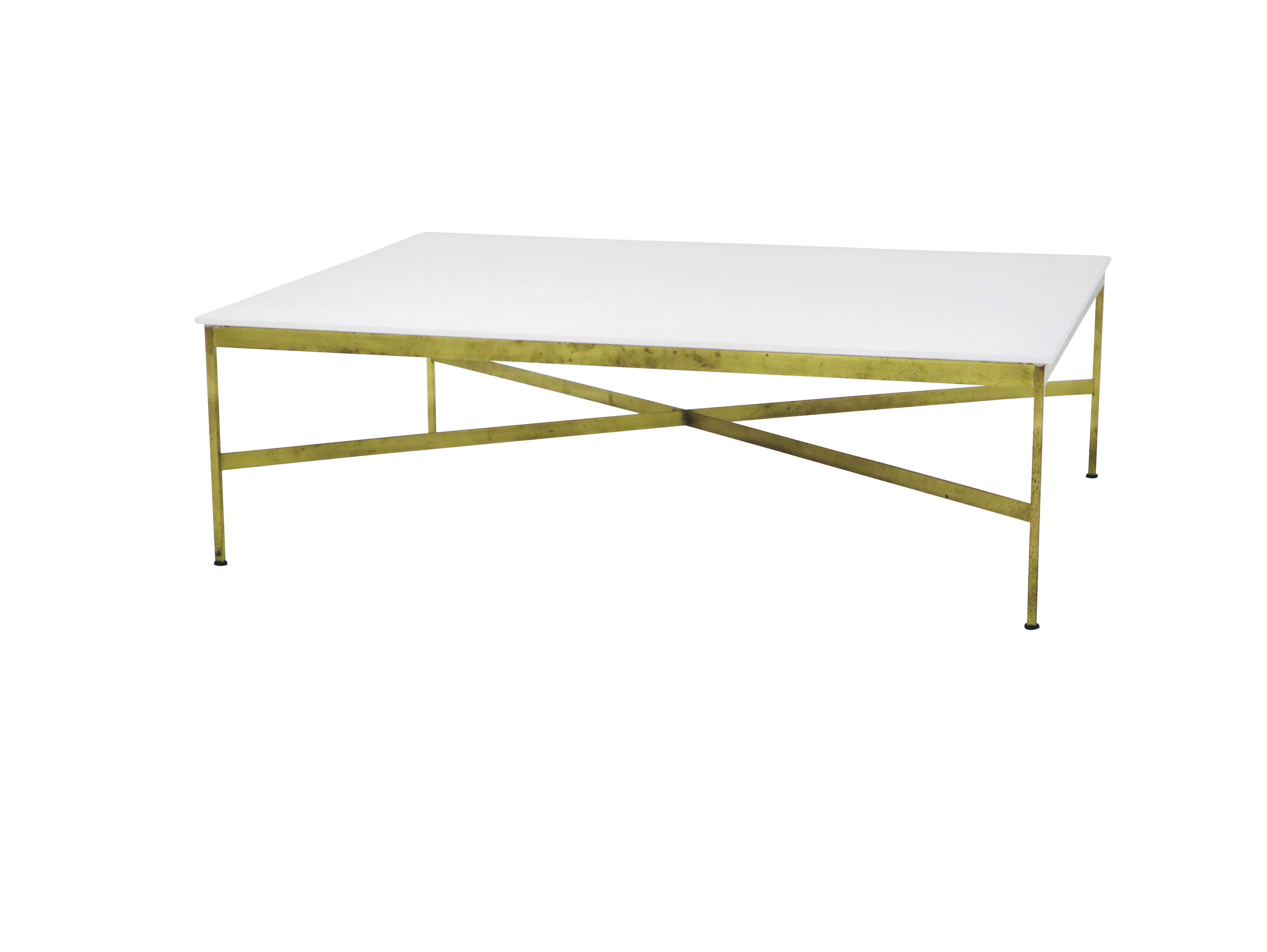 Brass frame coffee table with white Vitrolite glass. Designed by Paul McCobb for Calvin Furniture.